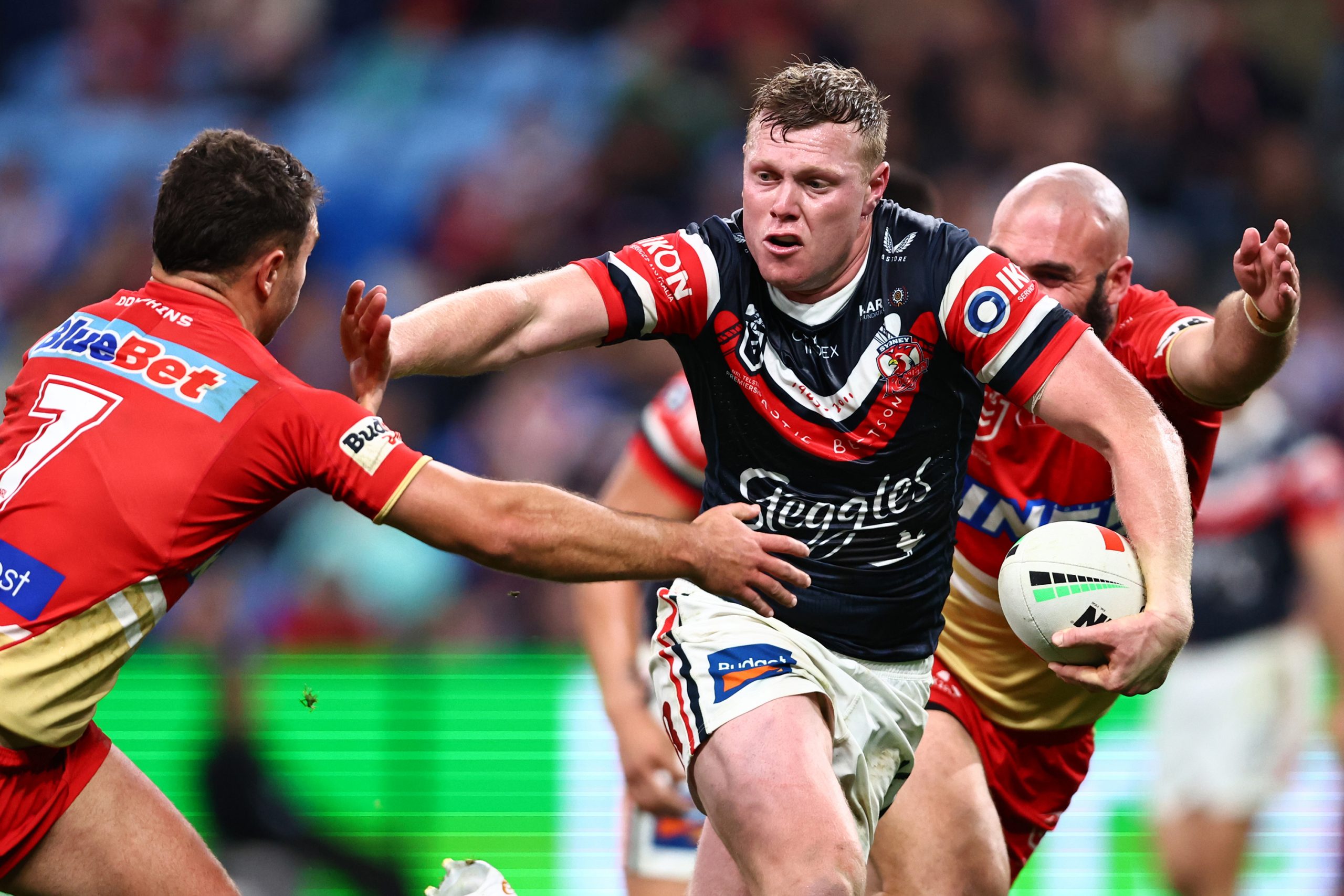 Drew Hutchison of the Roosters fends during the round 24 NRL match between Sydney Roosters and Dolphins at Allianz Stadium on August 12, 2023 in Sydney, Australia. (Photo by Jeremy Ng/Getty Images)