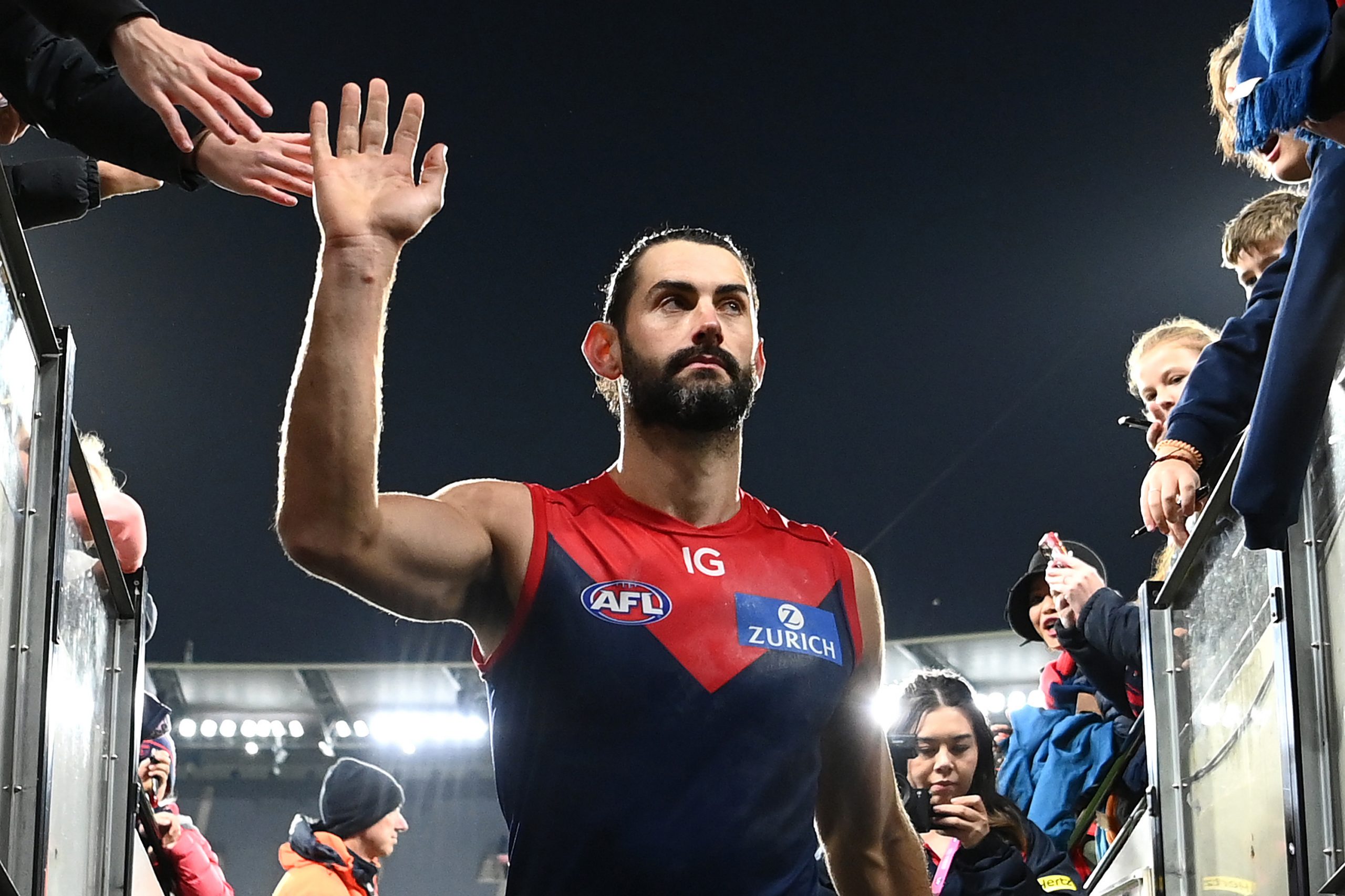 MELBOURNE, AUSTRALIA - APRIL 29: Brodie Grundy of the Demons high fives fans after winning the round seven AFL match between Melbourne Demons and North Melbourne Kangaroos at Melbourne Cricket Ground, on April 29, 2023, in Melbourne, Australia. (Photo by Quinn Rooney/Getty Images)