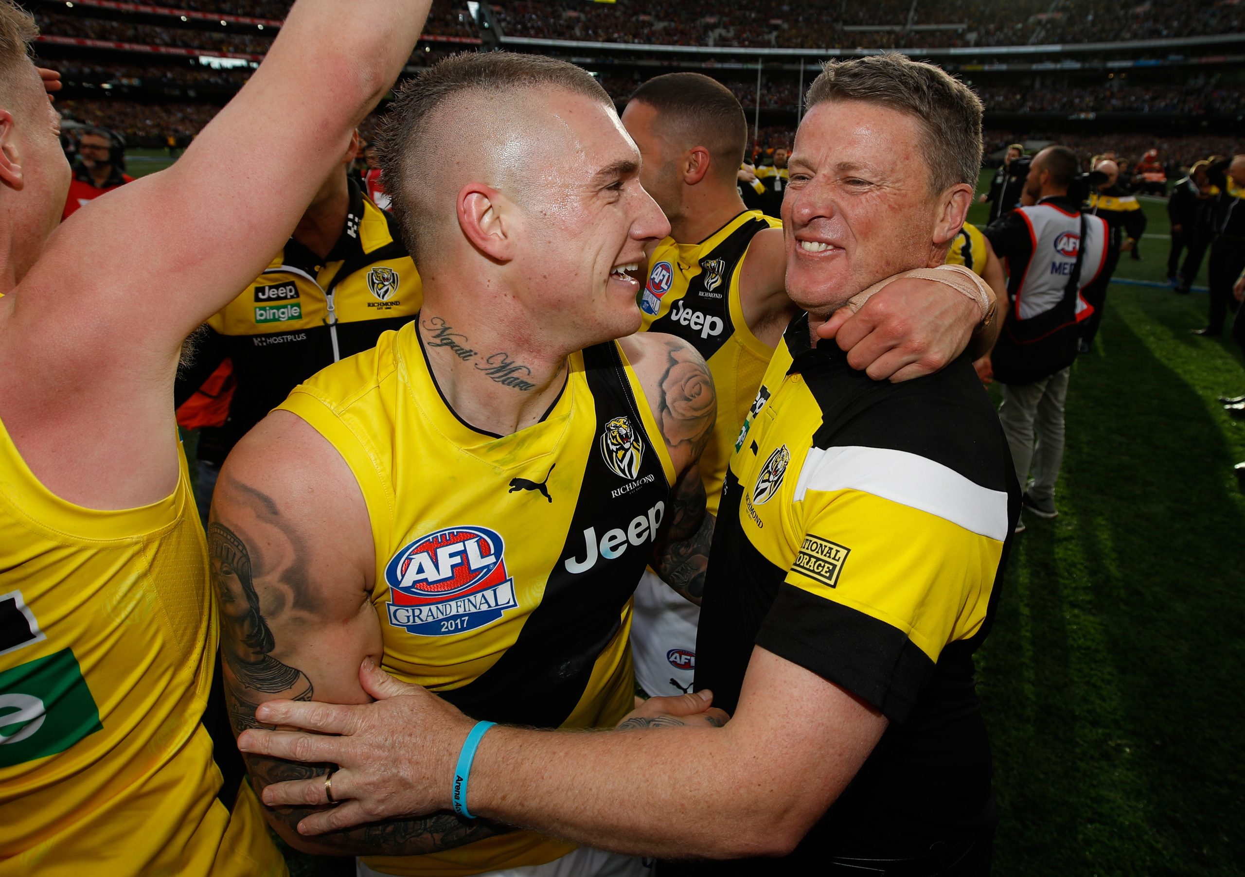 Dustin Martin and Damien Hardwick celebrate Richmond's victory in the 2017 AFL grand final.