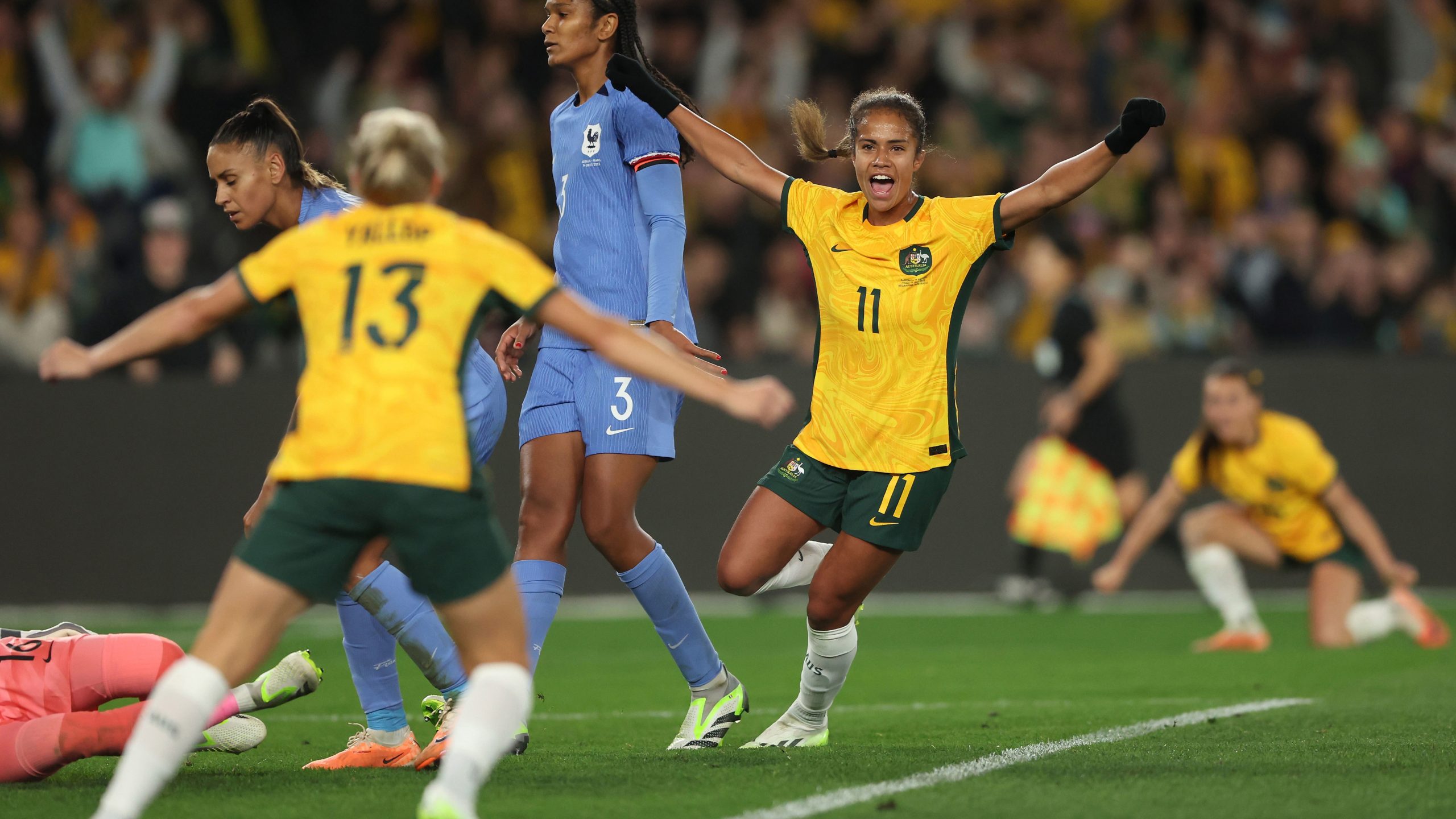 Matildas star Mary Fowler celebrates scoring a goal against France in the World Cup warm-up match in Melbourne.