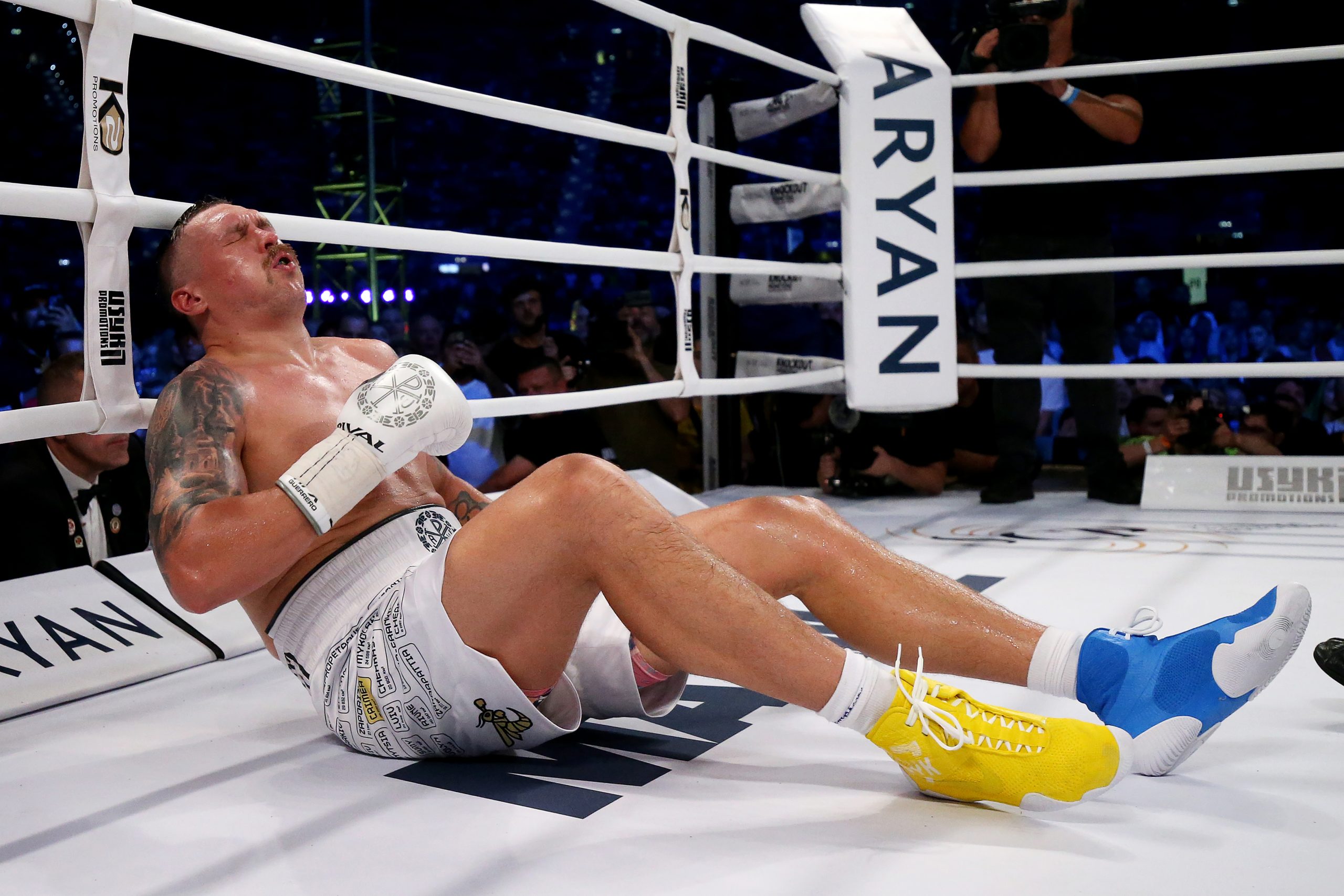 Oleksandr Usyk reacts after being knocked down by Daniel Dubois during the Heavyweight fight between Oleksandr Usyk and Daniel Dubois at Stadion Wroclaw on August 26, 2023 in Wroclaw, Poland. (Photo by Gabriel Kuchta/Getty Images)