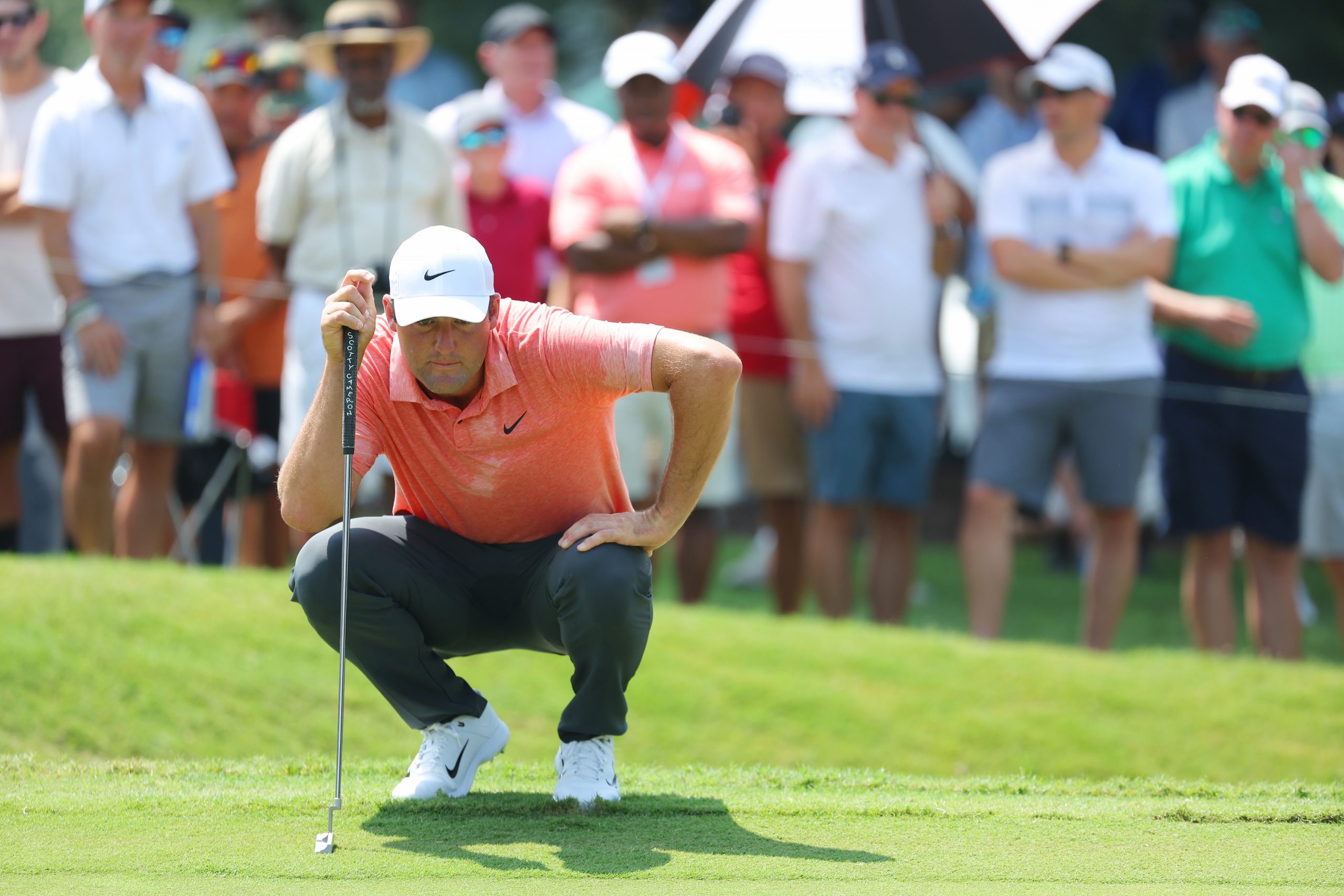 Scottie Scheffler of the United States lines up a putt on the first green during the first round of the TOUR Championship at East Lake Golf Club on August 24, 2023 in Atlanta, Georgia. (Photo by Kevin C. Cox/Getty Images)