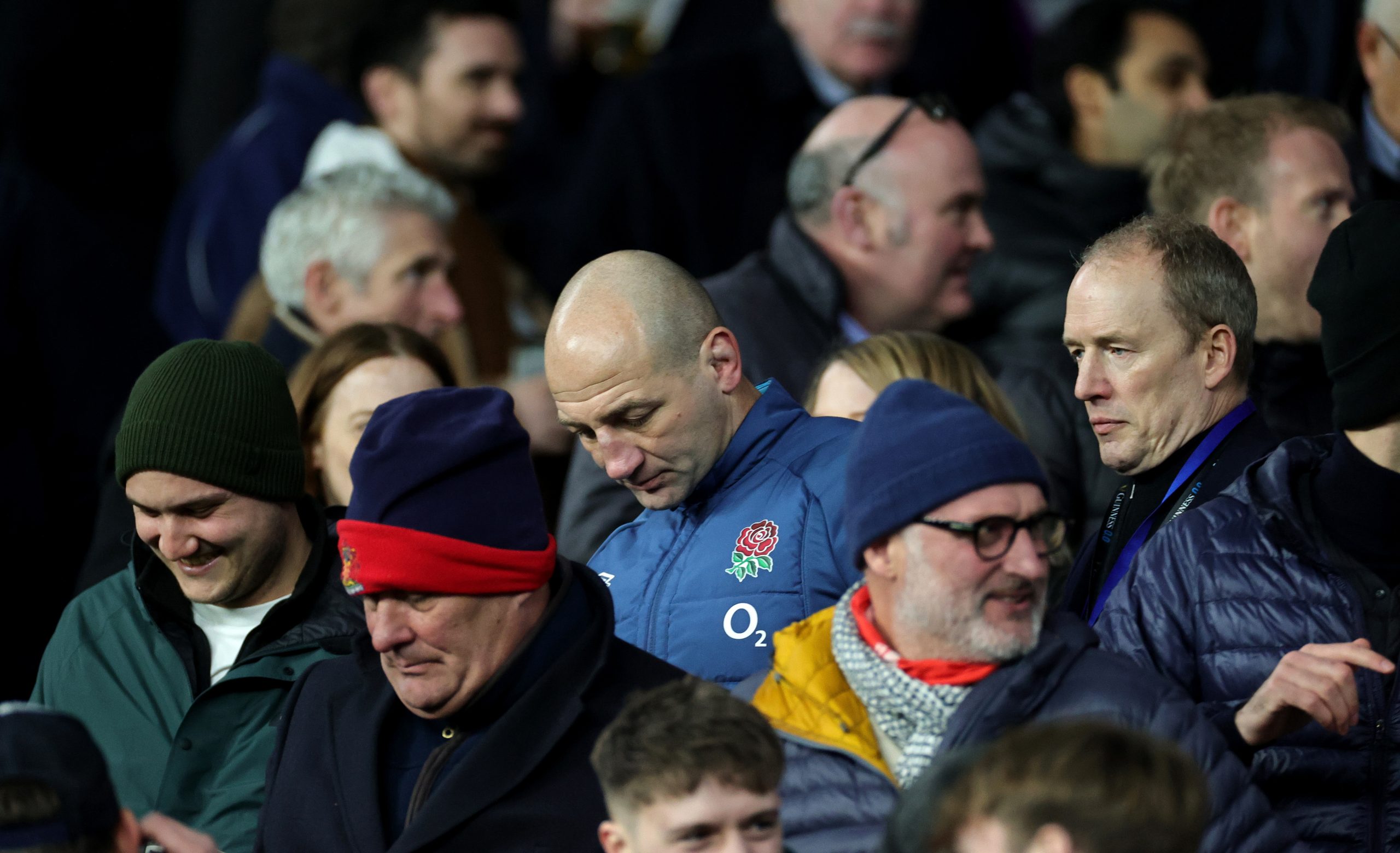 Steve Borthwick, the England head coach, looks dejected as he walks through the crowd.