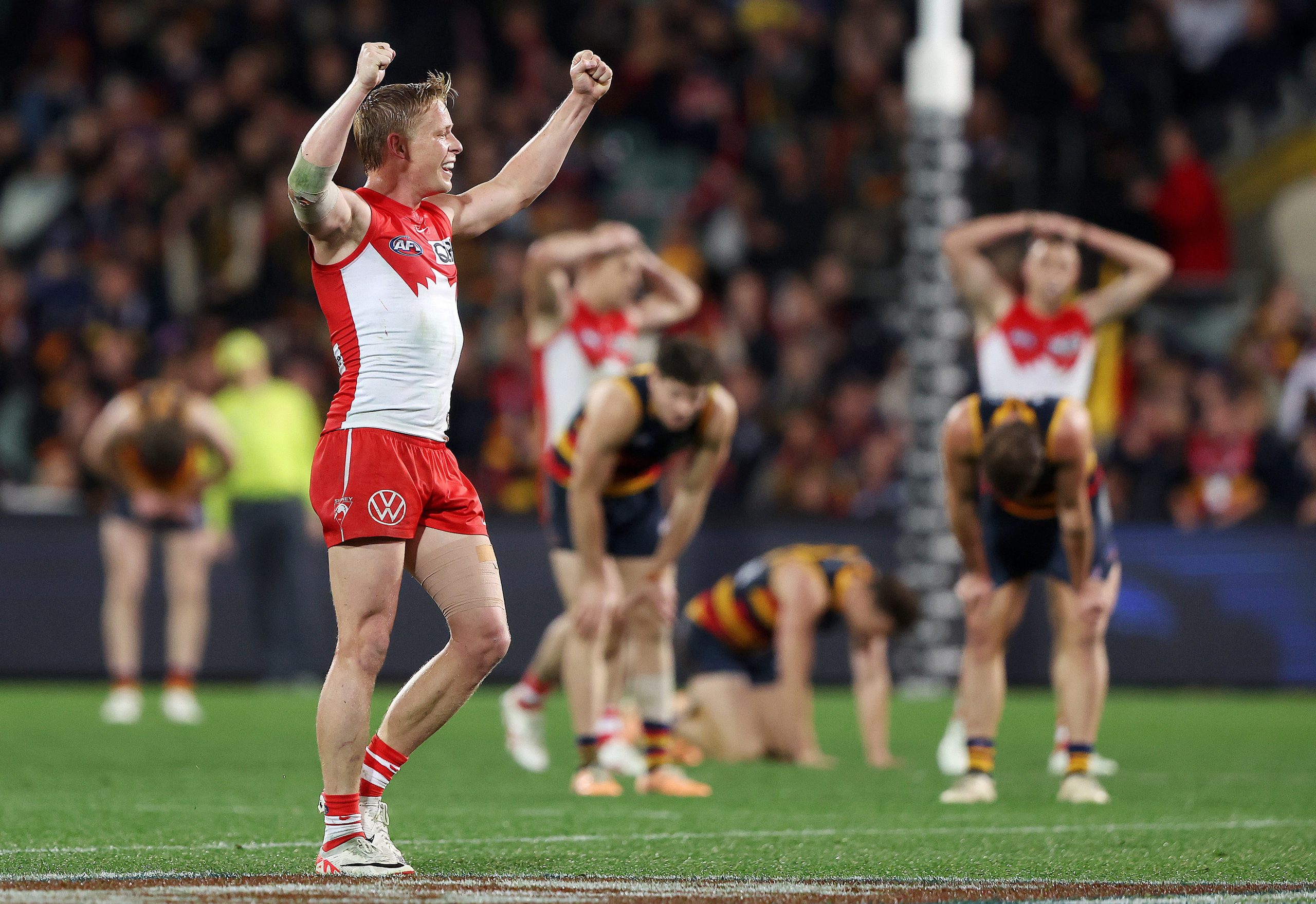 Swan Isaac Heeney celebrates after his side's one point win over Adelaide.