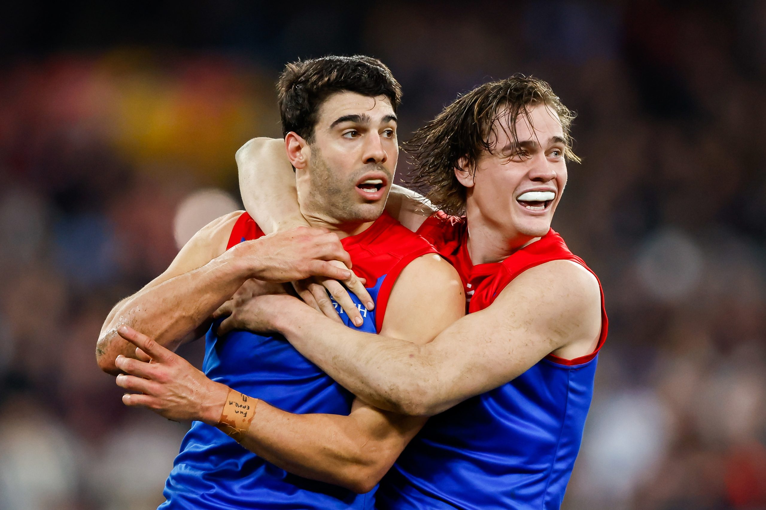 Christian Petracca and Trent Rivers celebrate and wait umpire confirmation on Saturday night.