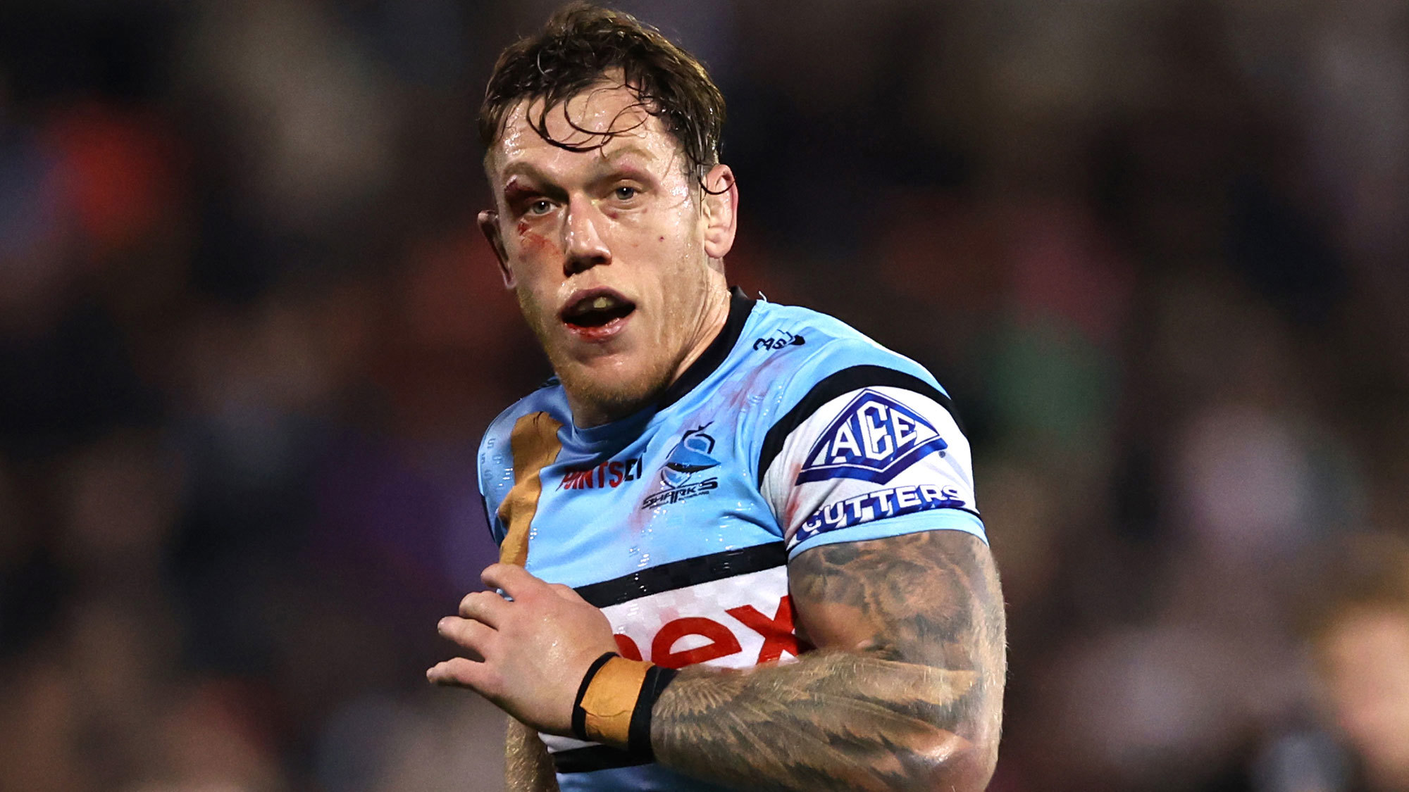 Cameron McInnes of the Sharks runs back to his mark injured during the round 22 match against the Penrith Panthers. 