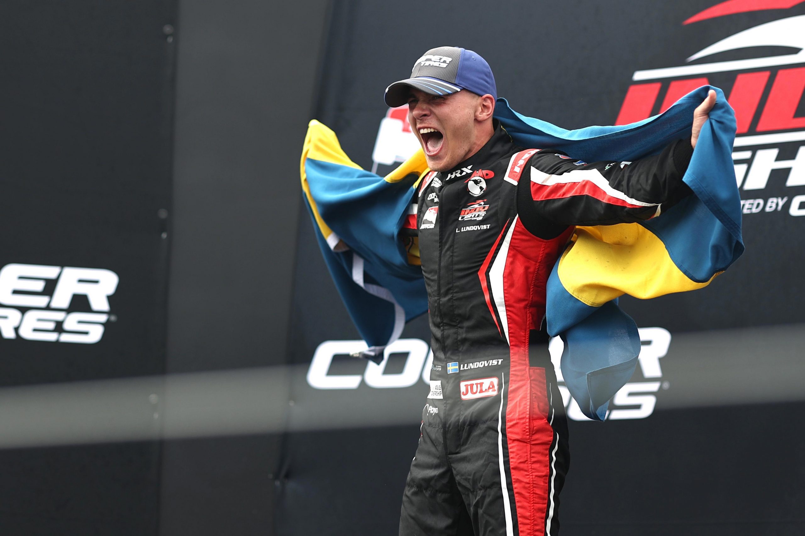 Linus Lundqvist celebrates winning the 2022 Indy Lights title.