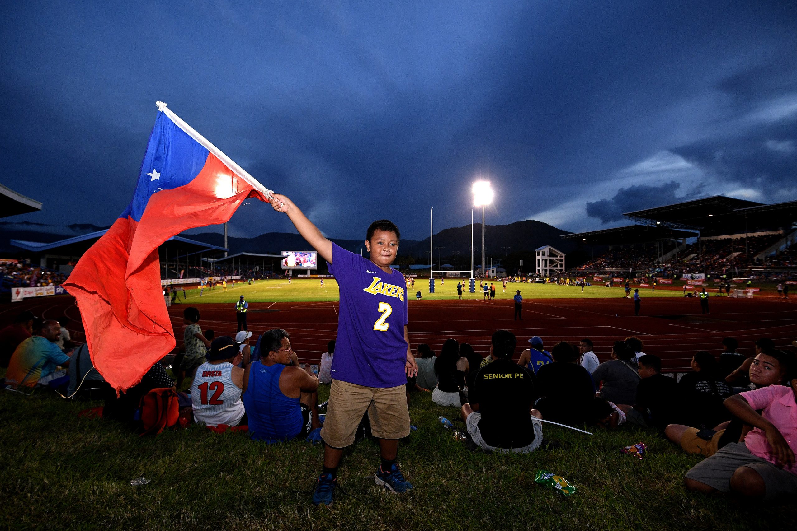 A fan poses for a photo during the round eight Super Rugby Pacific match between Moana Pasifika and Queensland Reds at Apia Park National Stadium.