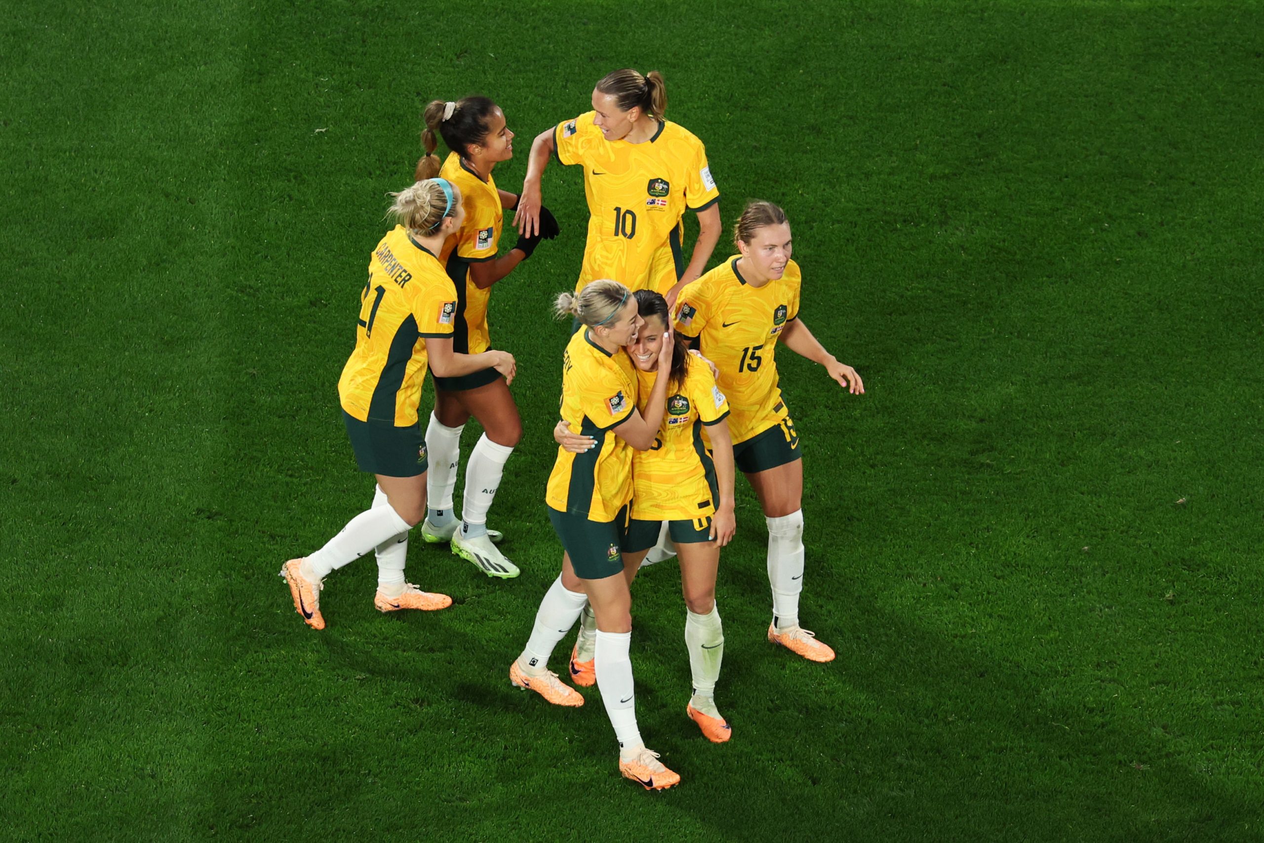 Hayley Raso celebrates with teammates after scoring the Matildas' second goal during the FIFA Women's World Cup Australia & New Zealand 2023 round of 16 match between Australia and Denmark at Stadium Australia.