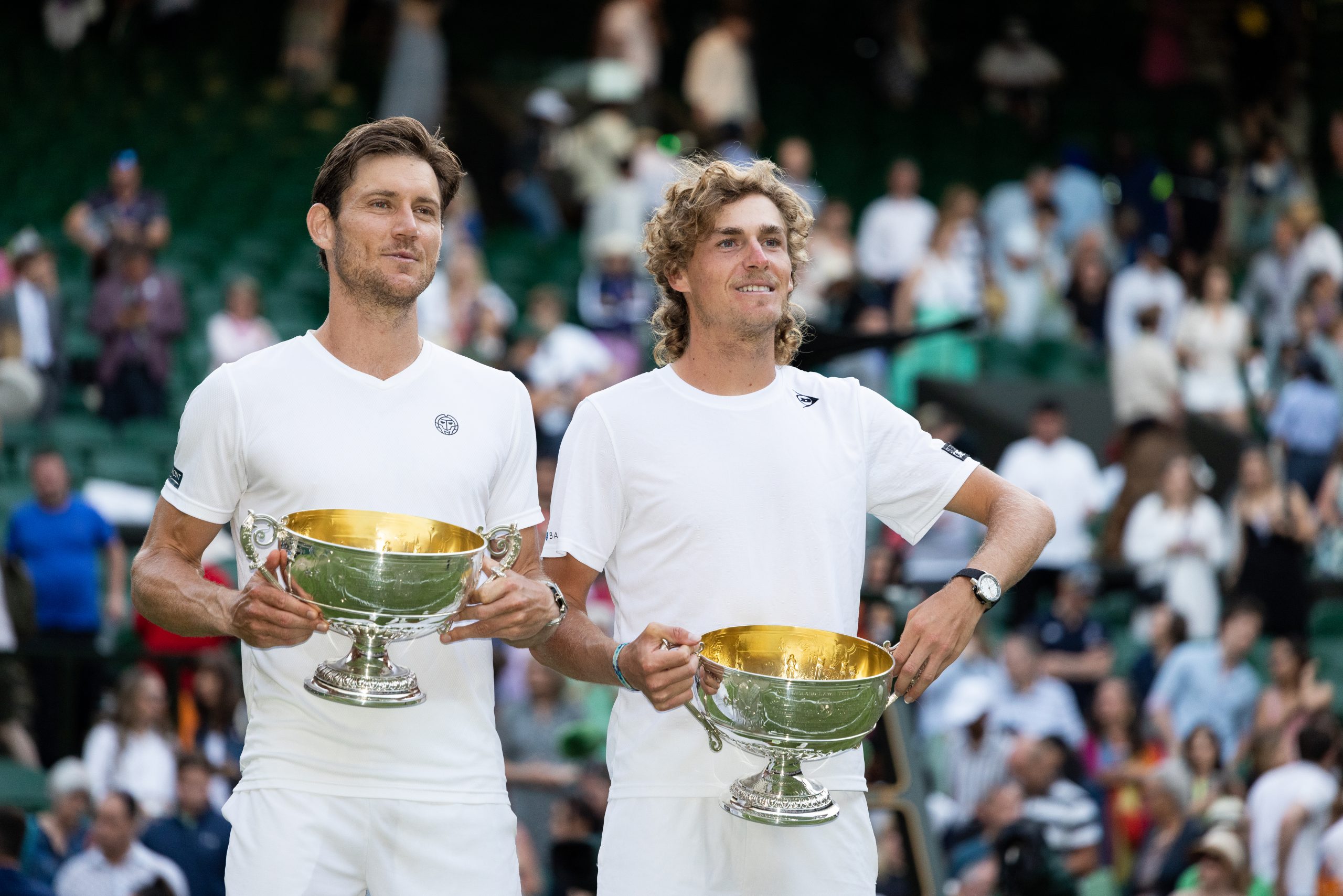 LONDON, ENGLAND - JULY 09: Matthew Ebden and Max Purcell both of Australia celebrate with their trophies after winning the Men's Doubles Final against Mate Pavic and Nikola Mektic both of Croatia at The Wimbledon Lawn Tennis Championship at the All England Lawn and Tennis Club at Wimbledon on July 9, 2022 in London, England. (Photo by Simon Bruty/Anychance/Getty Images)