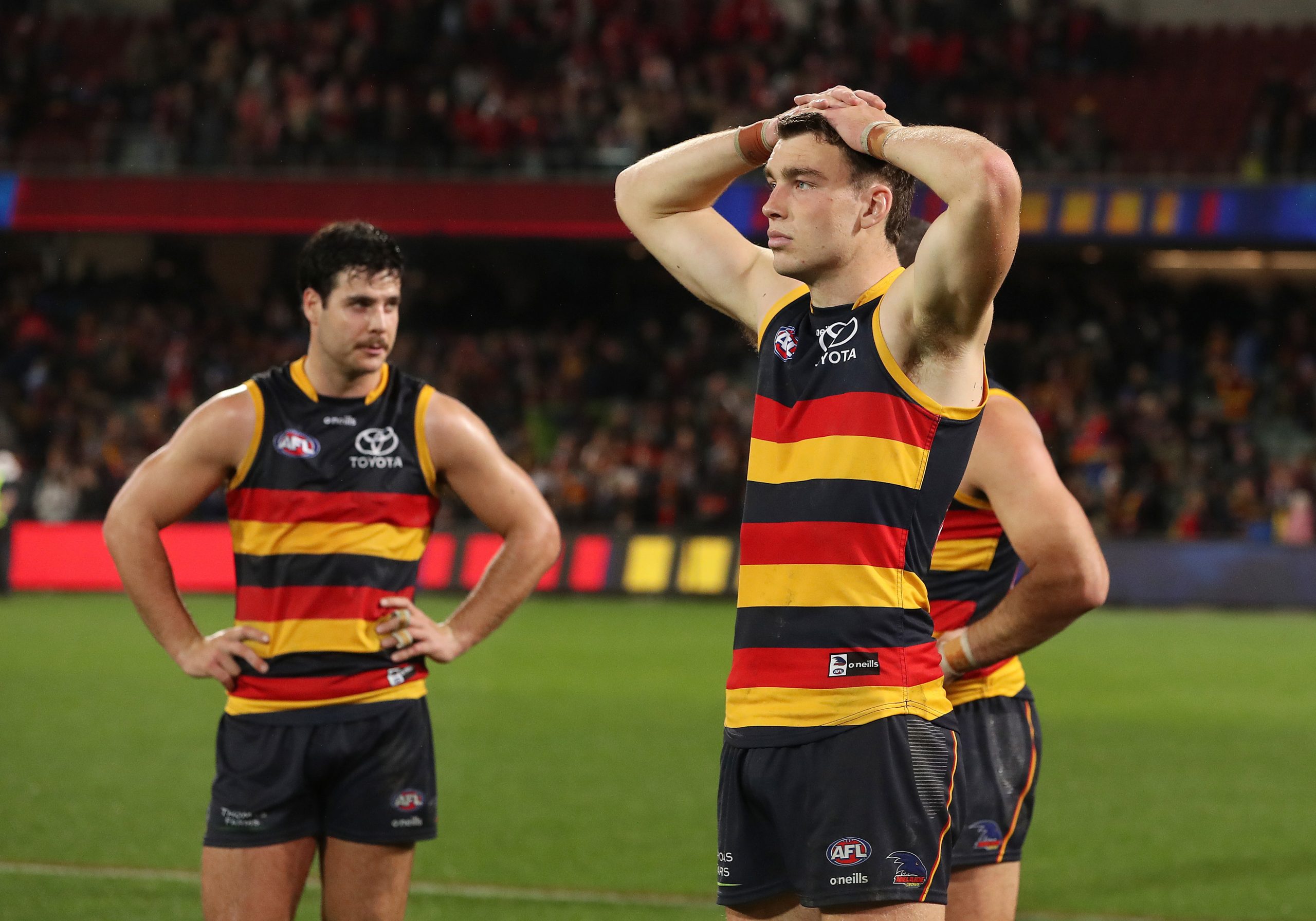 Riley Thilthorpe and Darcy Fogarty of the Crows after their loss to the Swans.