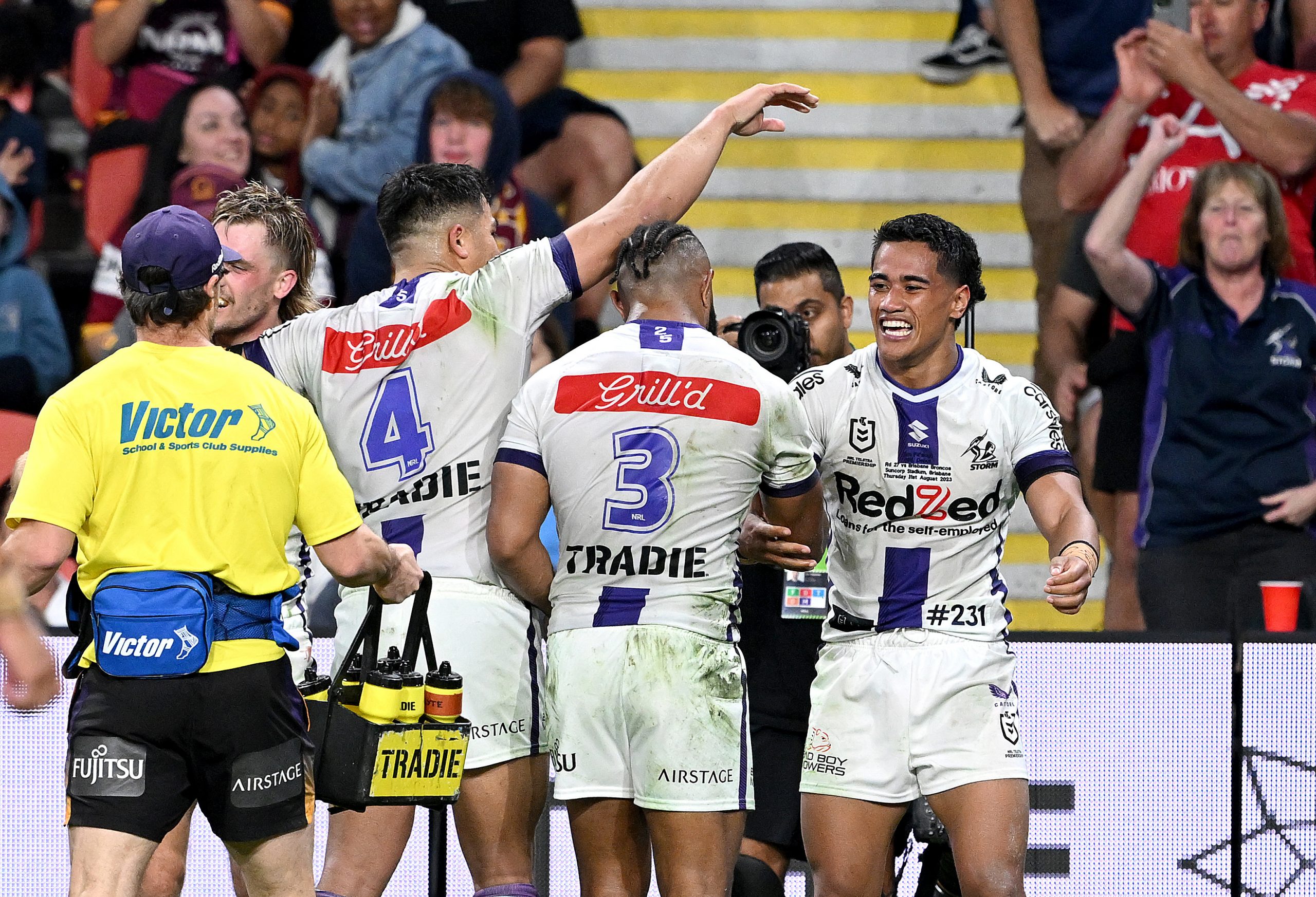 BRISBANE, AUSTRALIA - AUGUST 31: Sua Fa'alogo of the Storm celebrates with team mates after scoring a try during the round 27 NRL match between the Brisbane Broncos and Melbourne Storm at Suncorp Stadium on August 31, 2023 in Brisbane, Australia. (Photo by Bradley Kanaris/Getty Images)