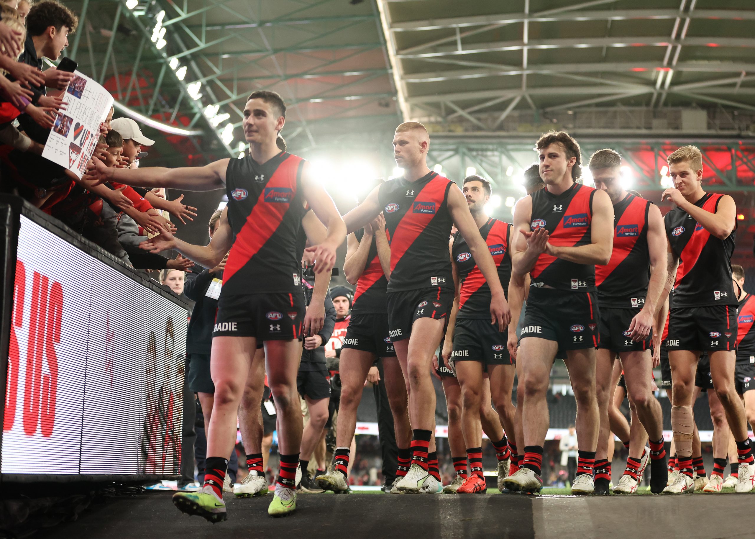 MELBOURNE, AUSTRALIA - AUGUST 05: The Bombers celebrate after they defeated the Eagles during the round 21 AFL match between Essendon Bombers and West Coast Eagles at Marvel Stadium, on August 05, 2023, in Melbourne, Australia. (Photo by Robert Cianflone/Getty Images)