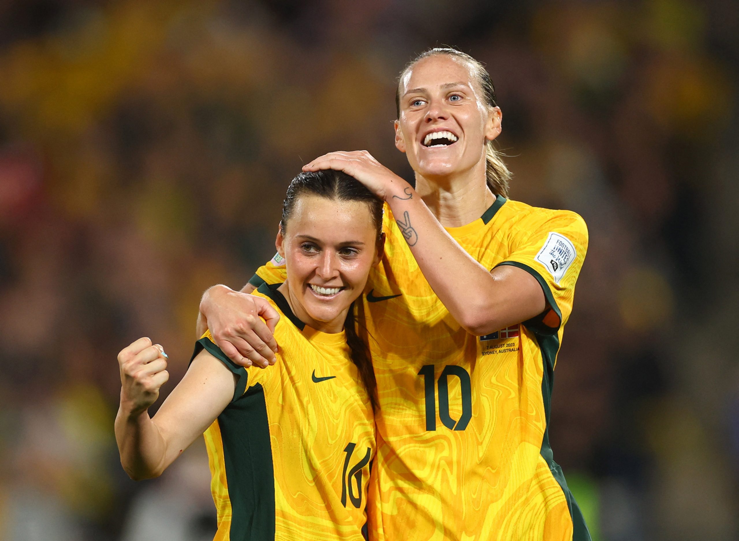 Australia's Hayley Raso celebrates scoring her first goal of the match with teammate Emily van Egmond.