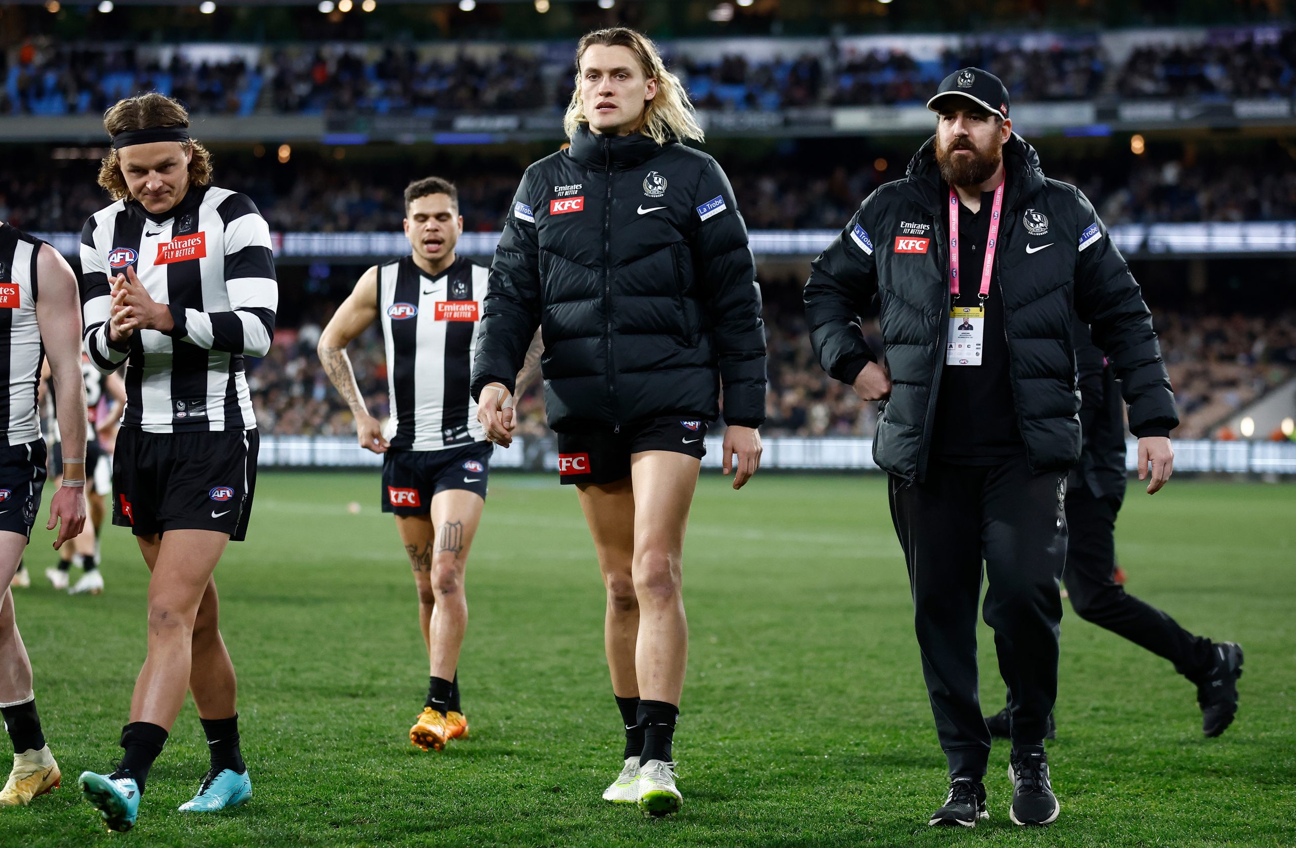 MELBOURNE, AUSTRALIA - AUGUST 11: Darcy Moore of the Magpies is seen after being subbed from the game with a leg injury during the 2023 AFL Round 22 match between the Collingwood Magpies and the Geelong Cats at Melbourne Cricket Ground on August 11, 2023 in Melbourne, Australia. (Photo by Michael Willson/AFL Photos via Getty Images)