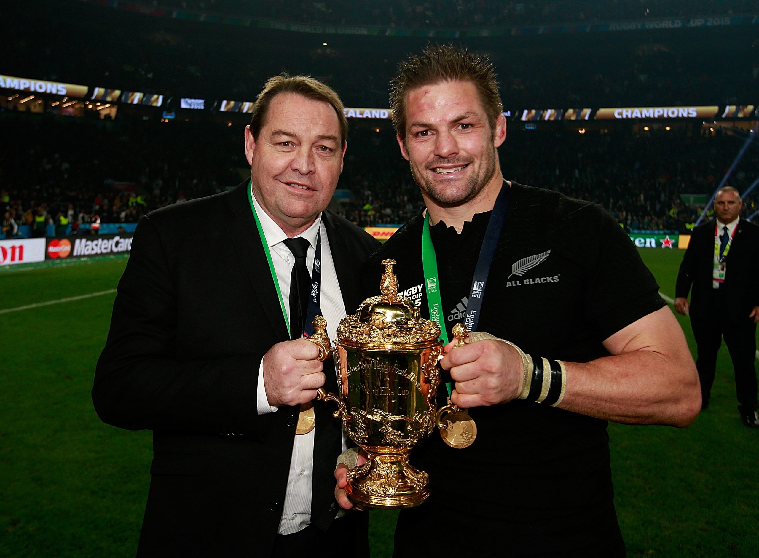 Then-All Backs head coach Steve Hansen (left) with captain Richie McCaw after winning the 2015 Rugby World Cup.