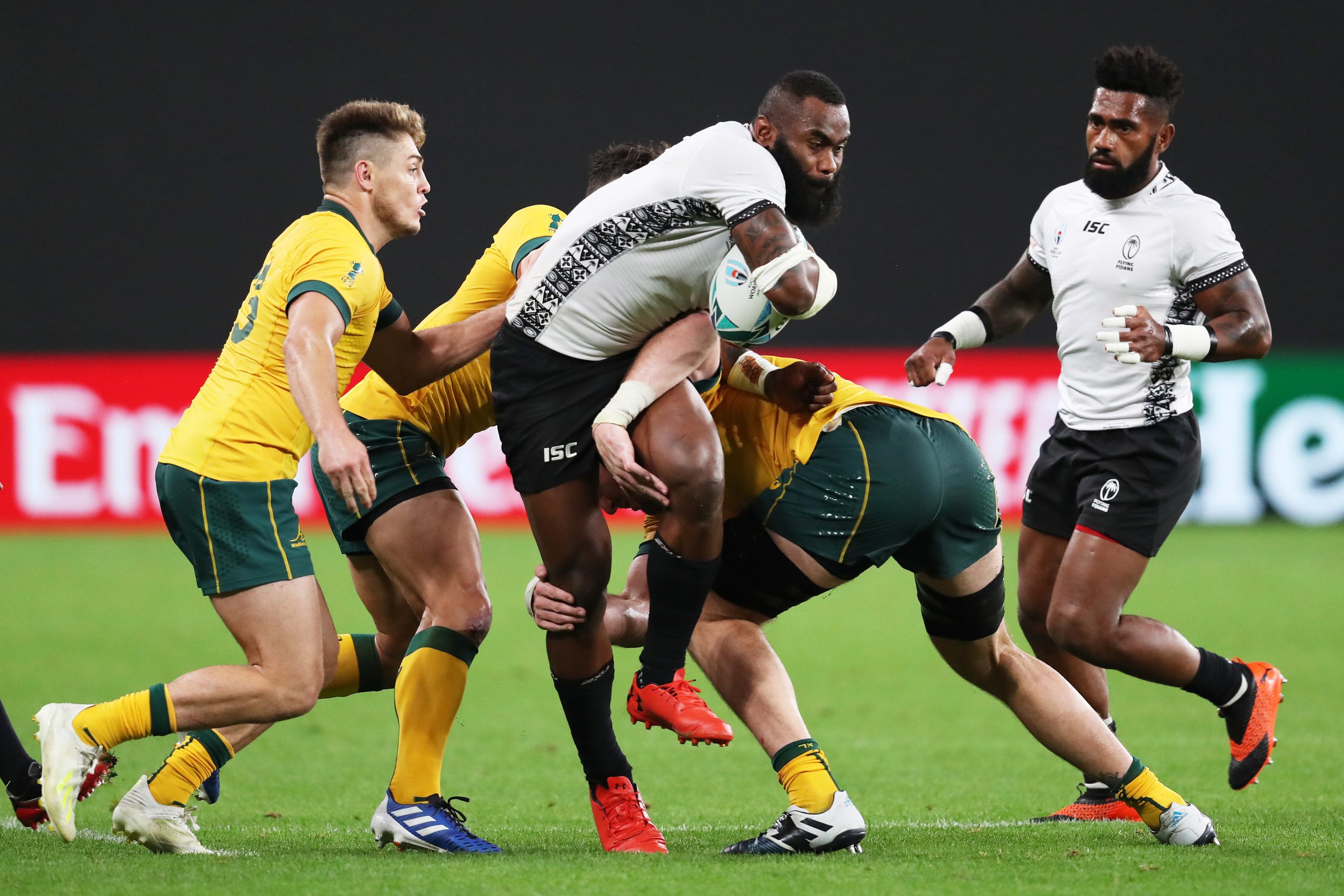 Semi Radradra of Fiji is tackled by Wallabies players in 2019.