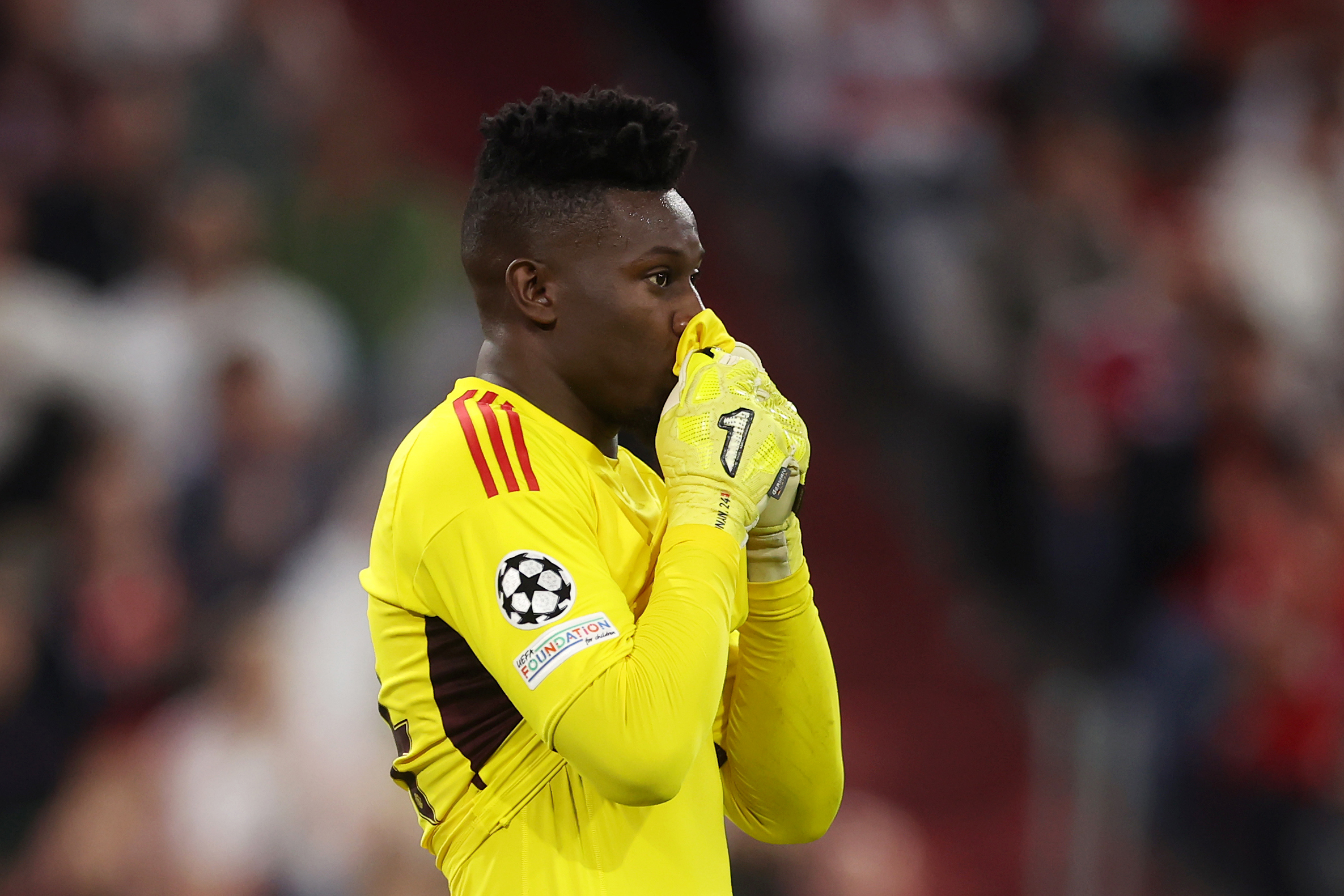 MUNICH, GERMANY - SEPTEMBER 20: Andre Onana of Manchester United reacts during the UEFA Champions League match between FC Bayern München and Manchester United at Allianz Arena on September 20, 2023 in Munich, Germany. (Photo by Alex Grimm/Getty Images)