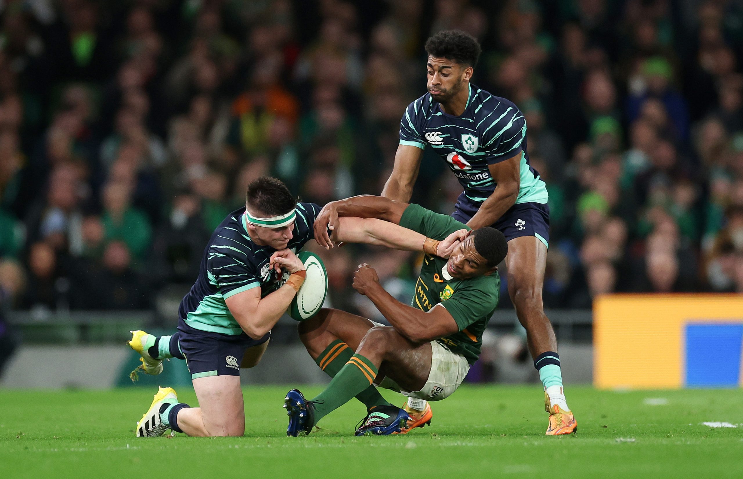 Dan Sheehan and Robert Baloucoune of Ireland battle for possession with Damian Willemse of South Africa in the 2022 Autumn International series.