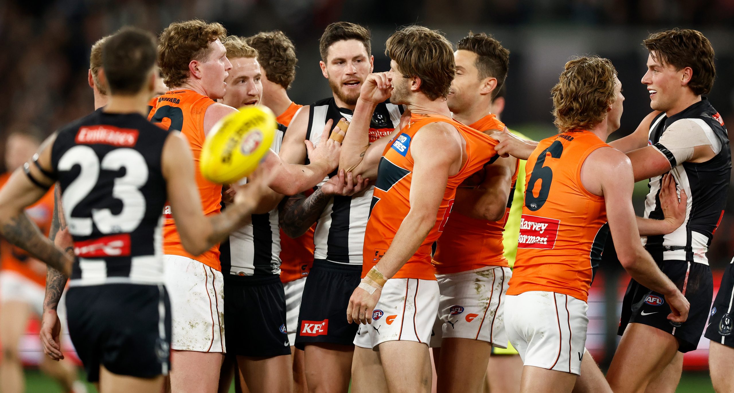 MELBOURNE, AUSTRALIA - SEPTEMBER 22: Players wrestle as the quarter time siren sounds during the 2023 AFL First Preliminary Final match between the Collingwood Magpies and the GWS GIANTS at Melbourne Cricket Ground on September 22, 2023 in Melbourne, Australia. (Photo by Michael Willson/AFL Photos via Getty Images)