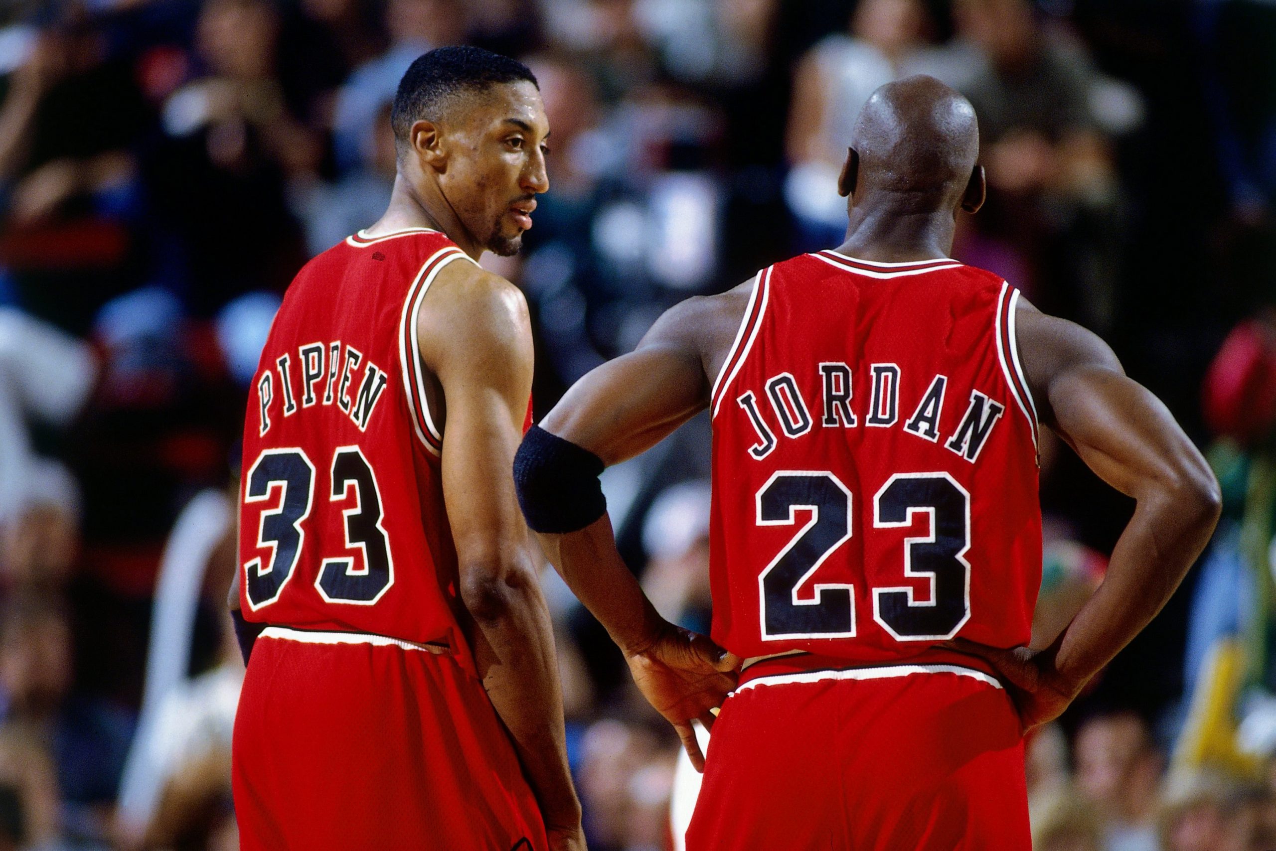 SEATTLE - JUNE 14:  Michael Jordan #23 and Scottie Pippen #33 of the Chicago Bulls discuss strategy against the Seattle SuperSonics in Game Five of the 1996 NBA Finals at Key Arena on June 14, 1996 in Seattle, Washington. The Sonics won 89-78.  NOTE TO USER: User expressly acknowledges that, by downloading and or using this photograph, User is consenting to the terms and conditions of the Getty Images License agreement. Mandatory Copyright Notice: Copyright 1996 NBAE (Photo by Barry Gossage/NBAE
