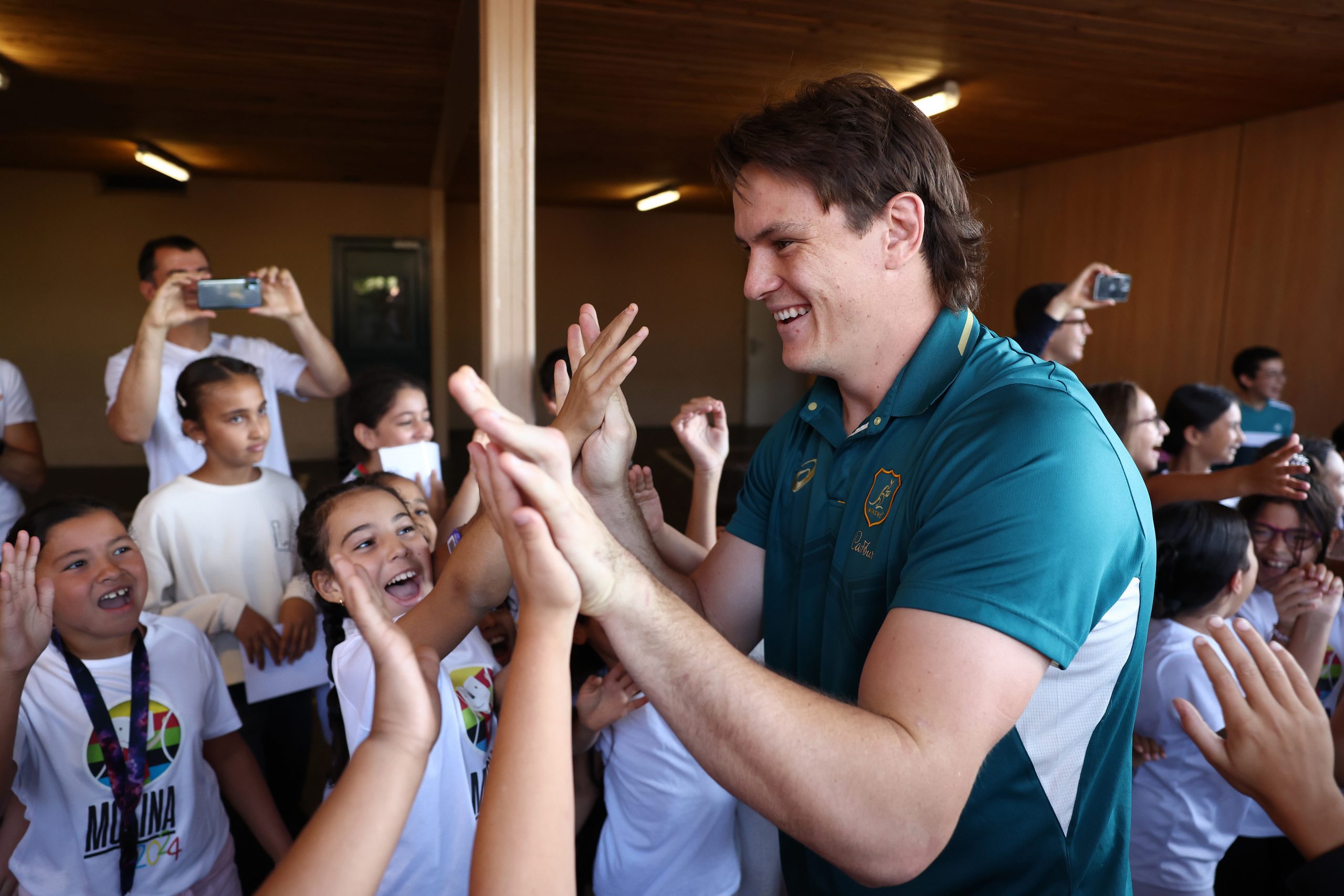 Tom Hooper of the Wallabies arrives at a school visit.