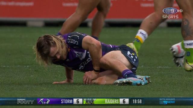 Ryan Papenhuyzen of the Storm clutches his injured knee.