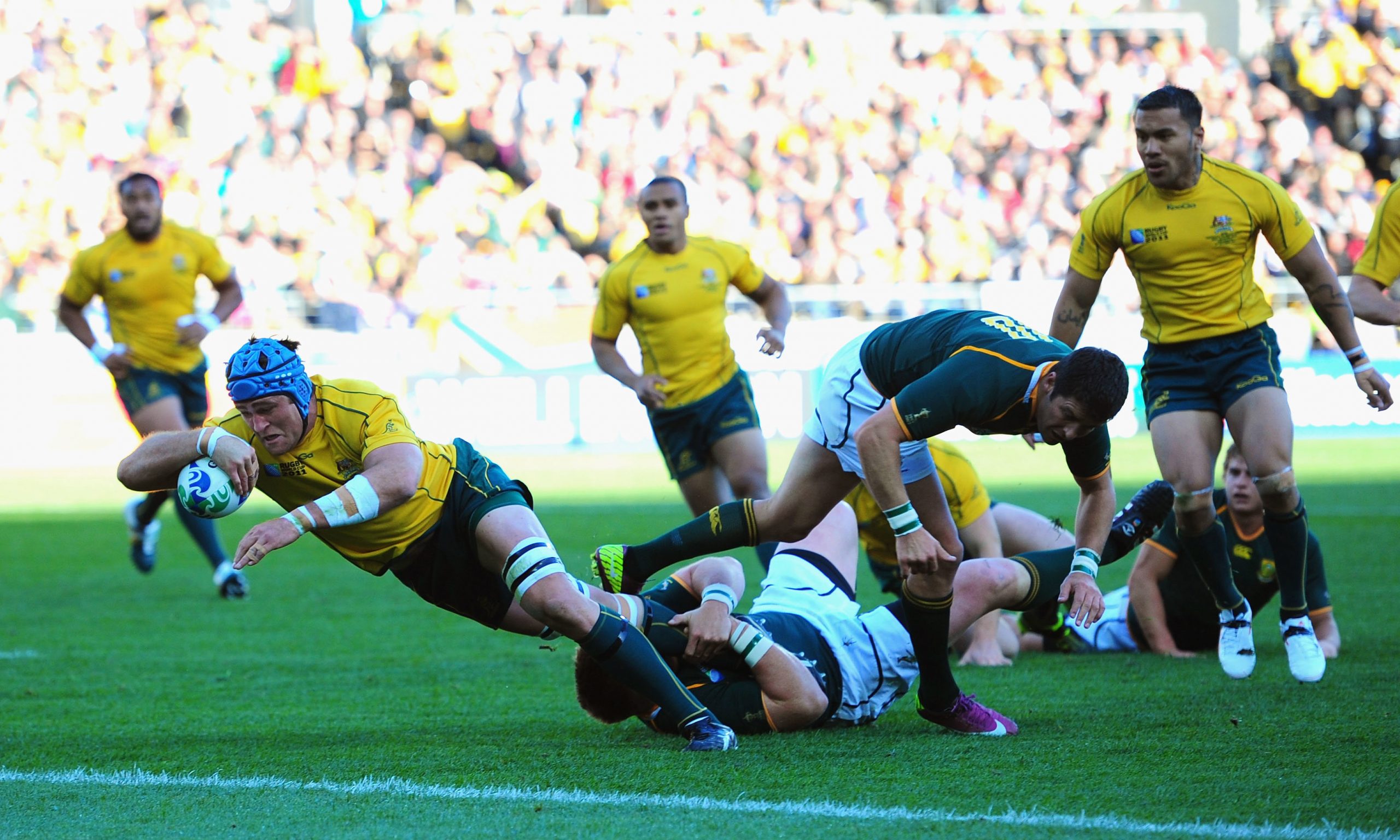 James Horwill of Australia goes over the line to score in Wellington.