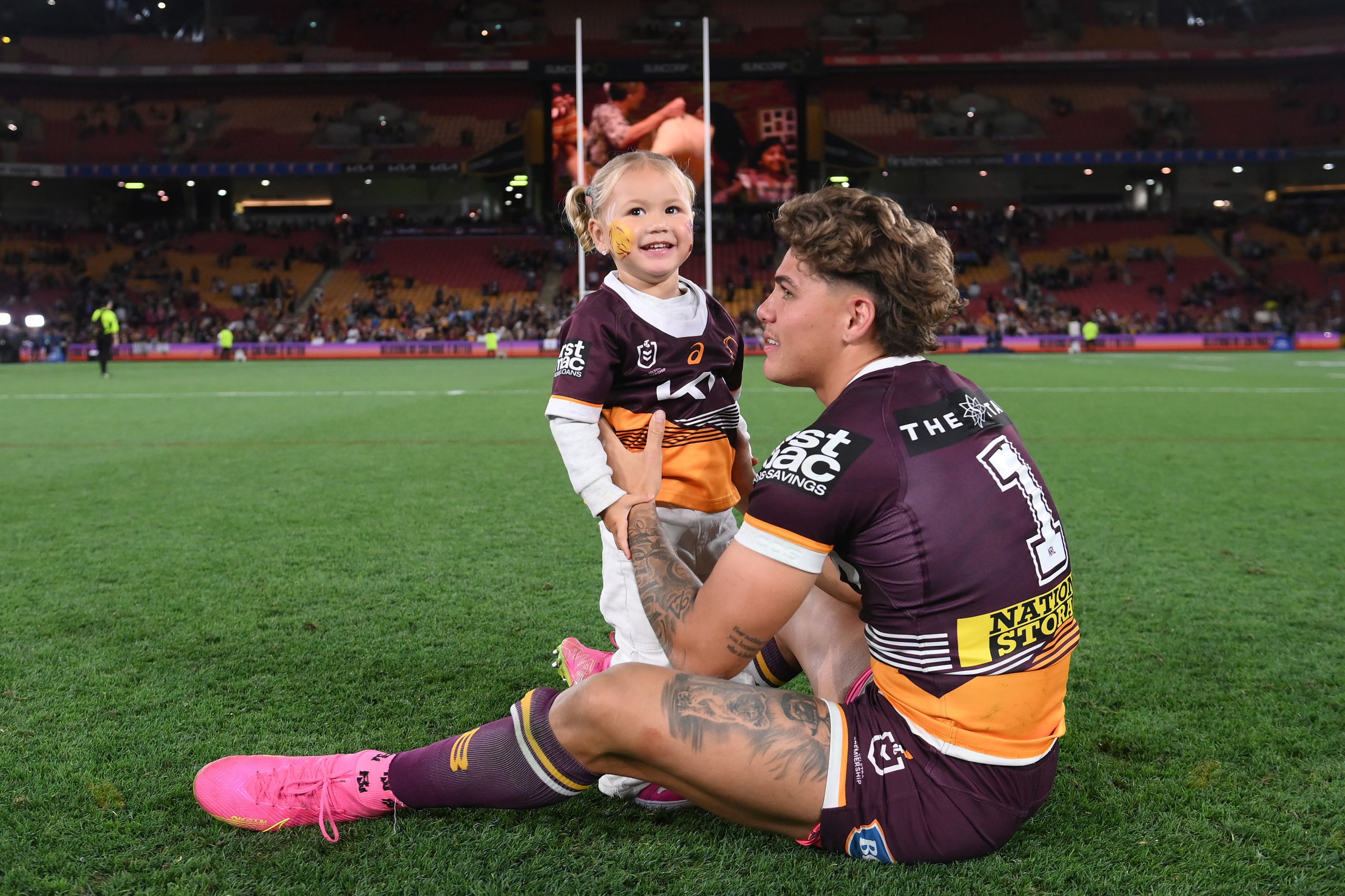 Reece Walsh of the Broncos celebrates with his daughter Leila after winning the NRL Preliminary Final match between Brisbane Broncos and New Zealand Warriors at Suncorp Stadium on September 23, 2023 in Brisbane, Australia. (Photo by Bradley Kanaris/Getty Images)