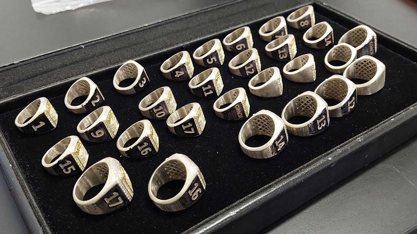 Unveiling of the 2023 NRL and NRLW Premiership rings. The front row is NRL rings, while the back three rows are the slightly smaller NRLW rings. The rings have the same design and construction.