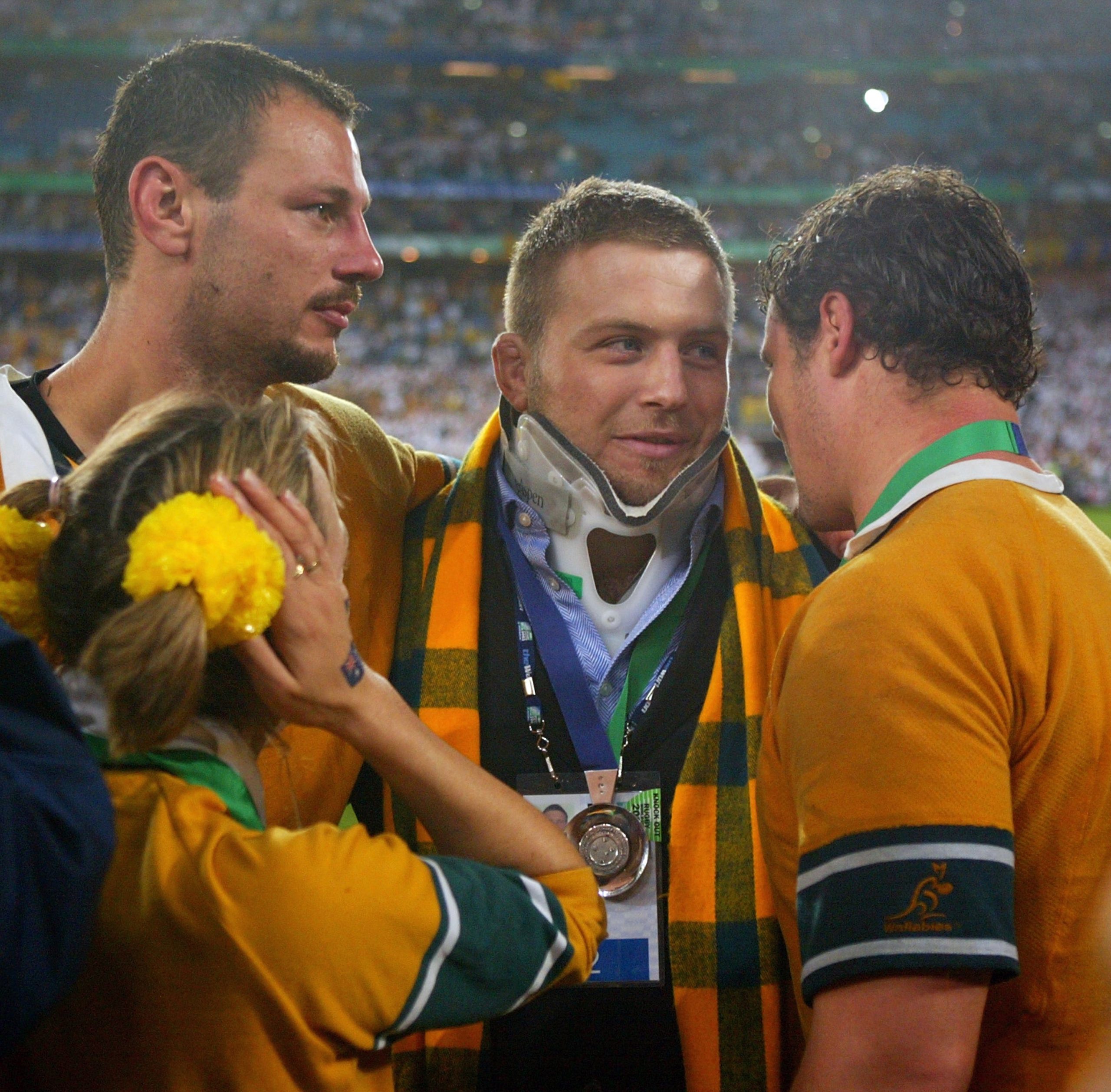 Ben Darwin consoles Matt Cockbain and Al Baxter of the Wallabies after England won the 2003 Rugby World Cup final.