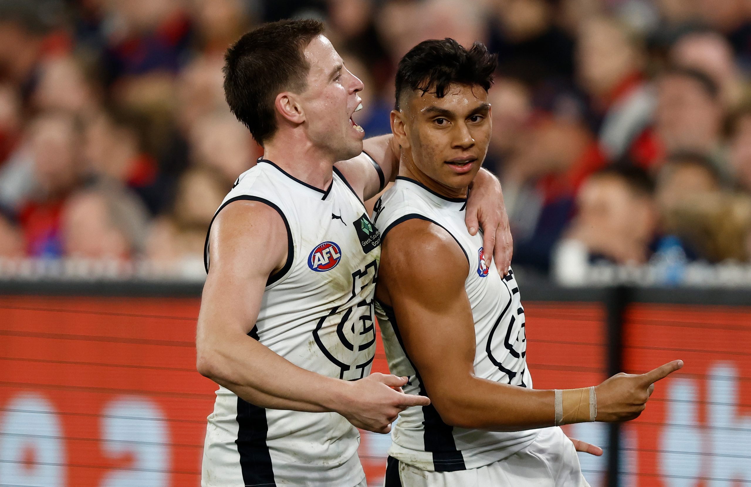 MELBOURNE, AUSTRALIA - SEPTEMBER 15: Matthew Owies (left) and Jesse Motlop of the Blues celebrate during the 2023 AFL First Semi Final match between the Melbourne Demons and the Carlton Blues at Melbourne Cricket Ground on September 15, 2023 in Melbourne, Australia. (Photo by Michael Willson/AFL Photos via Getty Images)