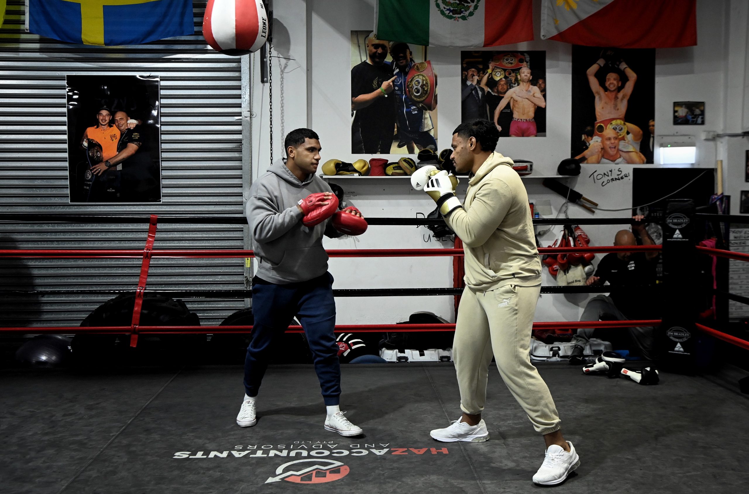 Tevita Pangai (left) trains with his brother Jermaine Pangai  (right) spar.