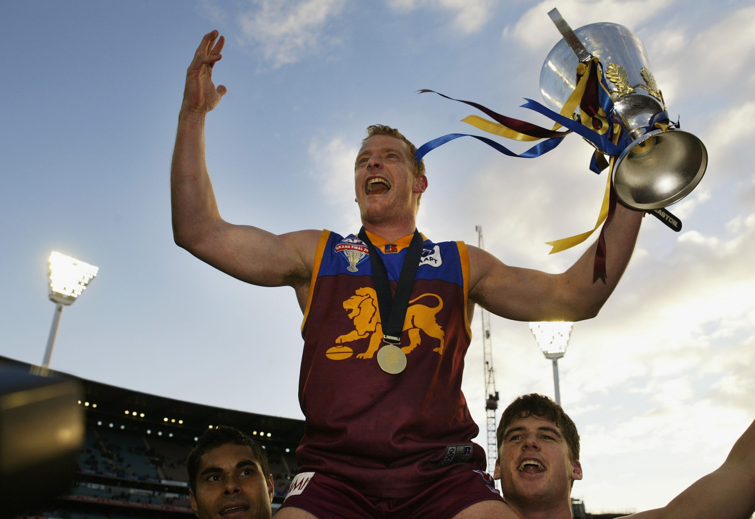 MELBOURNE, AUSTRALIA - SEPTEMBER 27:  Michael Voss #3 for Brisbane celebrates with the cup after the AFL Grand Final between the Collingwood Magpies and the Brisbane Lions at the Melbourne Cricket Ground September 27, 2003 in Melbourne, Australia. (Photo by Hamish Blair/Getty Images)