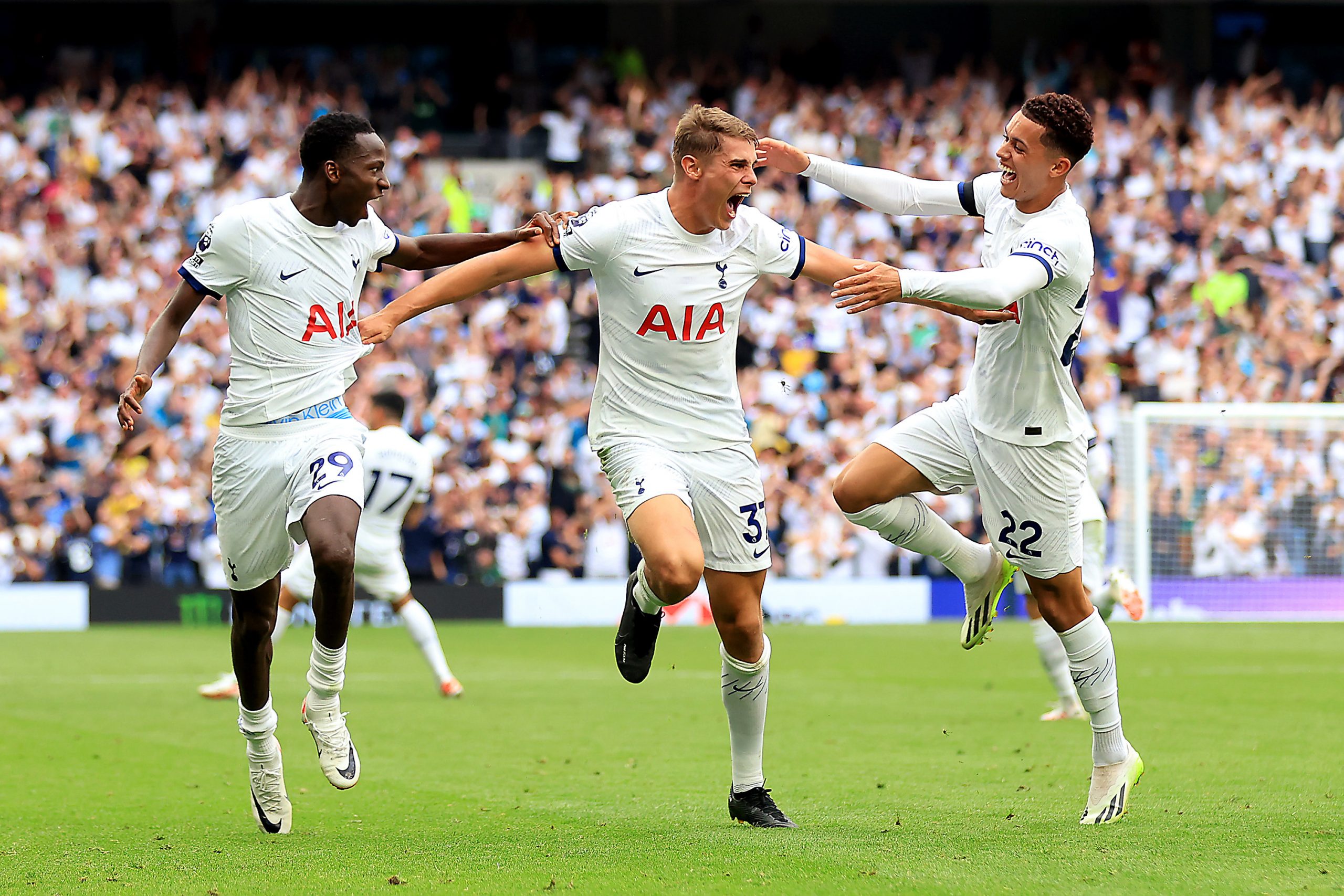 Pape Matar Sarr, Micky van de Ven and Brennan Johnson of Tottenham Hotspur celebrate after Dejan Kulusevski scores their team's game-winning goal.