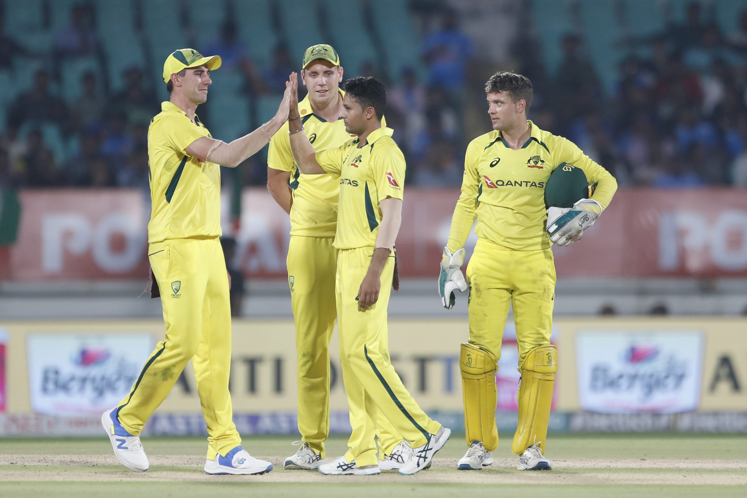 Tanveer Sangha of Australia celebrates the wicket of Ravindra Jadeja.