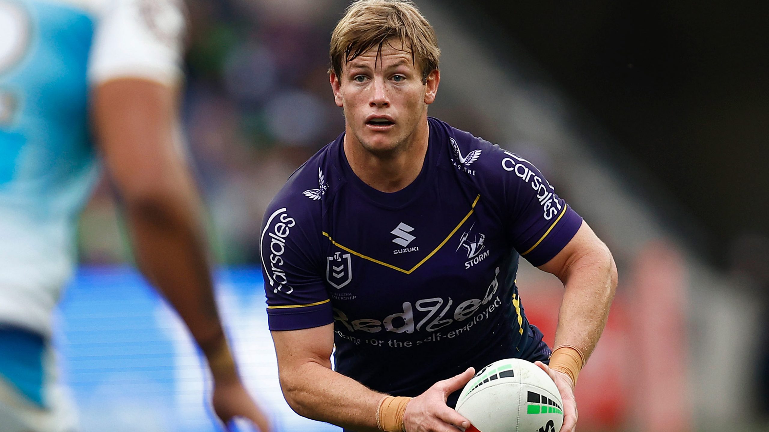 Storm star Harry Grant runs with the ball against the Titans. 