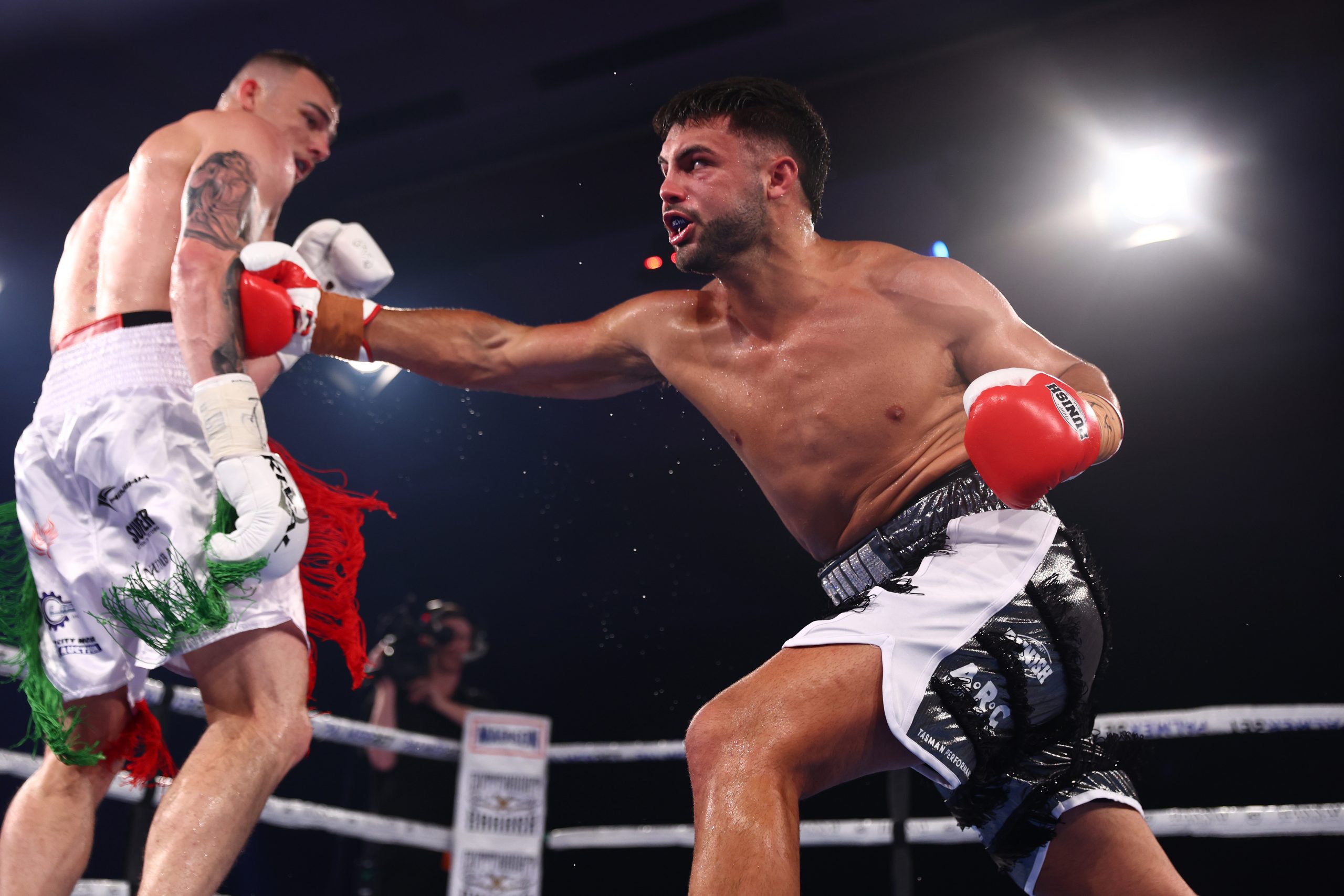 Ricky Esliva and Luke Modini exchange punches during their Cruiserweight fight at The Star Gold Coast on December 03, 2022 in Gold Coast, Australia. (Photo by Chris Hyde/Getty Images)