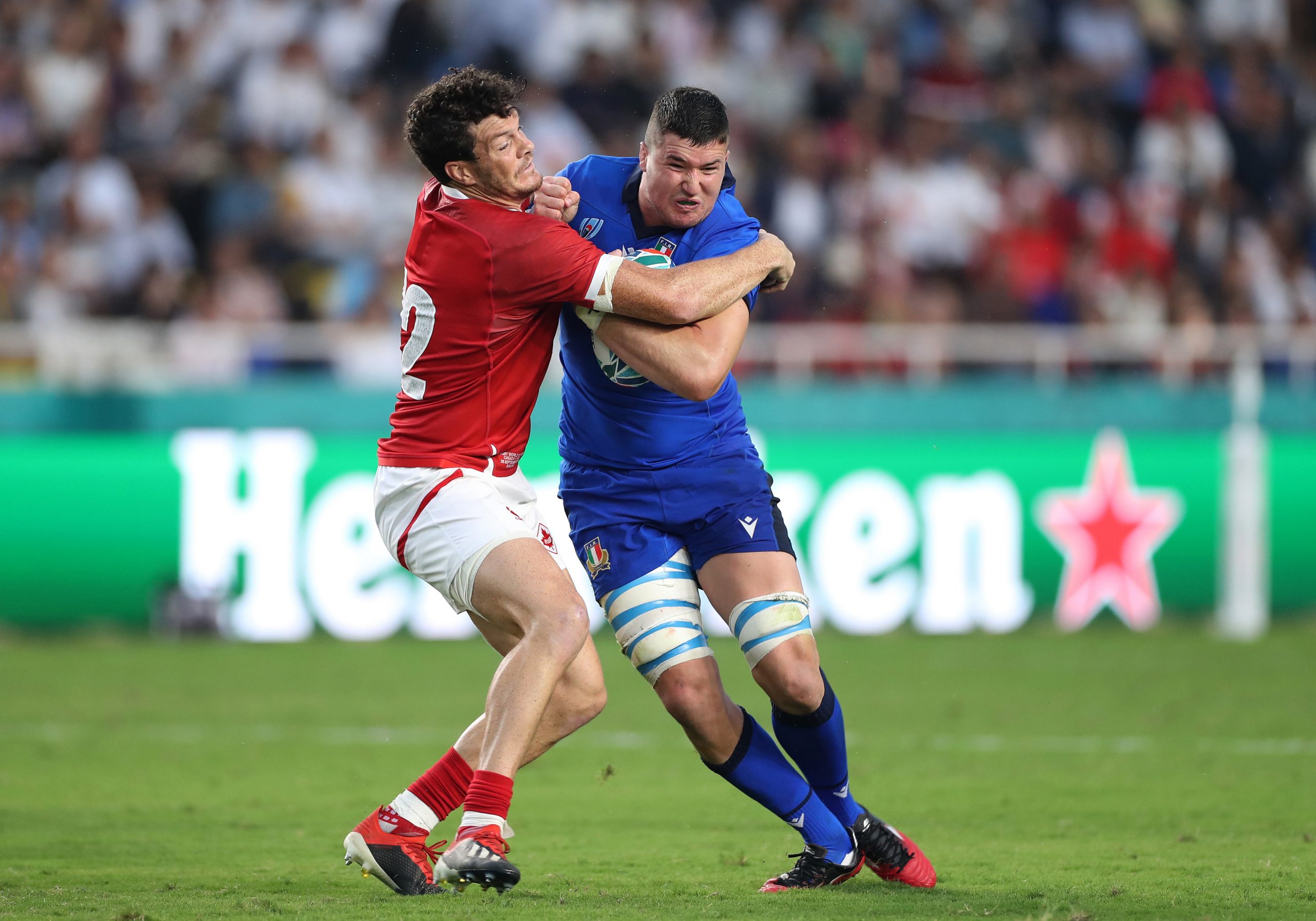 Sebastian Negri is tackled by Ciaran Hearn of Canada.