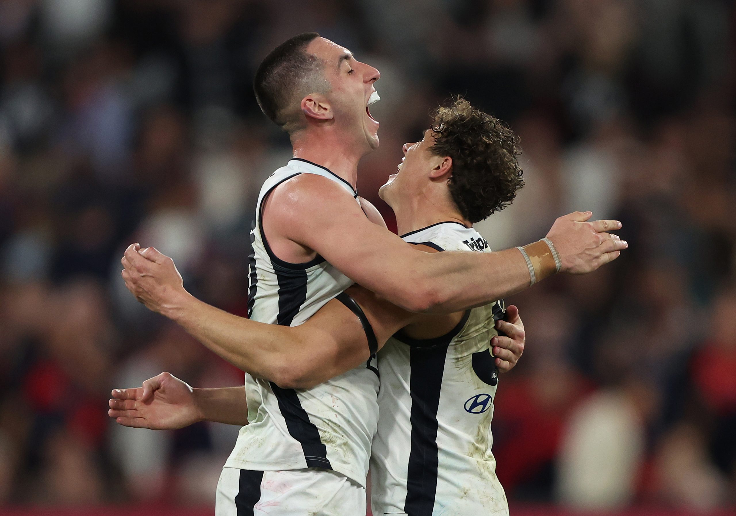 MELBOURNE, AUSTRALIA - SEPTEMBER 15: Jacob Weitering and Charlie Curnow of the Blues celebrate after the Blues defeated the Demons during the AFL First Semi Final match between Melbourne Demons and Carlton Blues at Melbourne Cricket Ground, on September 15, 2023, in Melbourne, Australia. (Photo by Robert Cianflone/Getty Images)