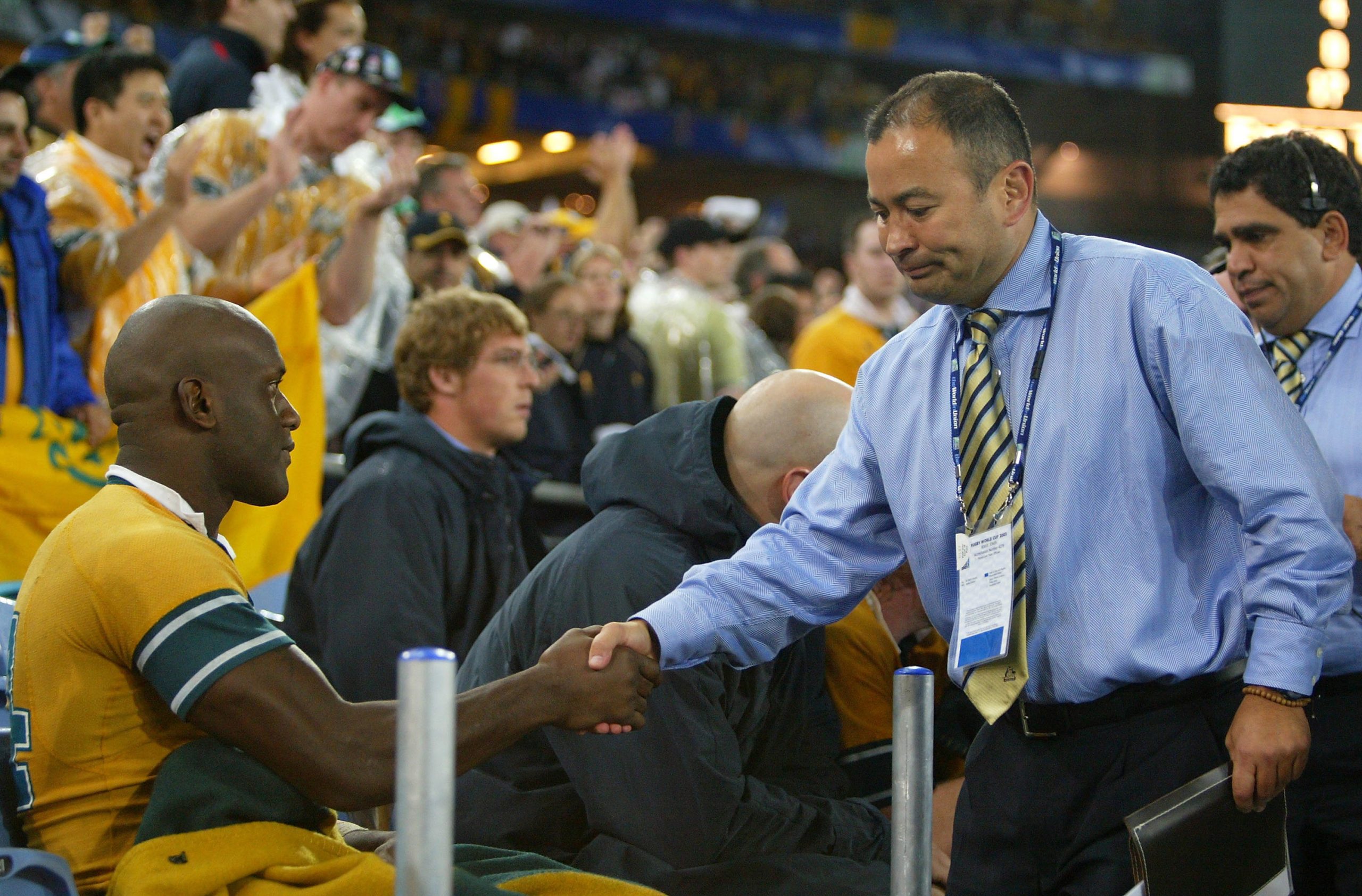 Wallabies coach Eddie Jones shakes hands with Wendell Sailor after losing the 2003 Rugby World Cup final.