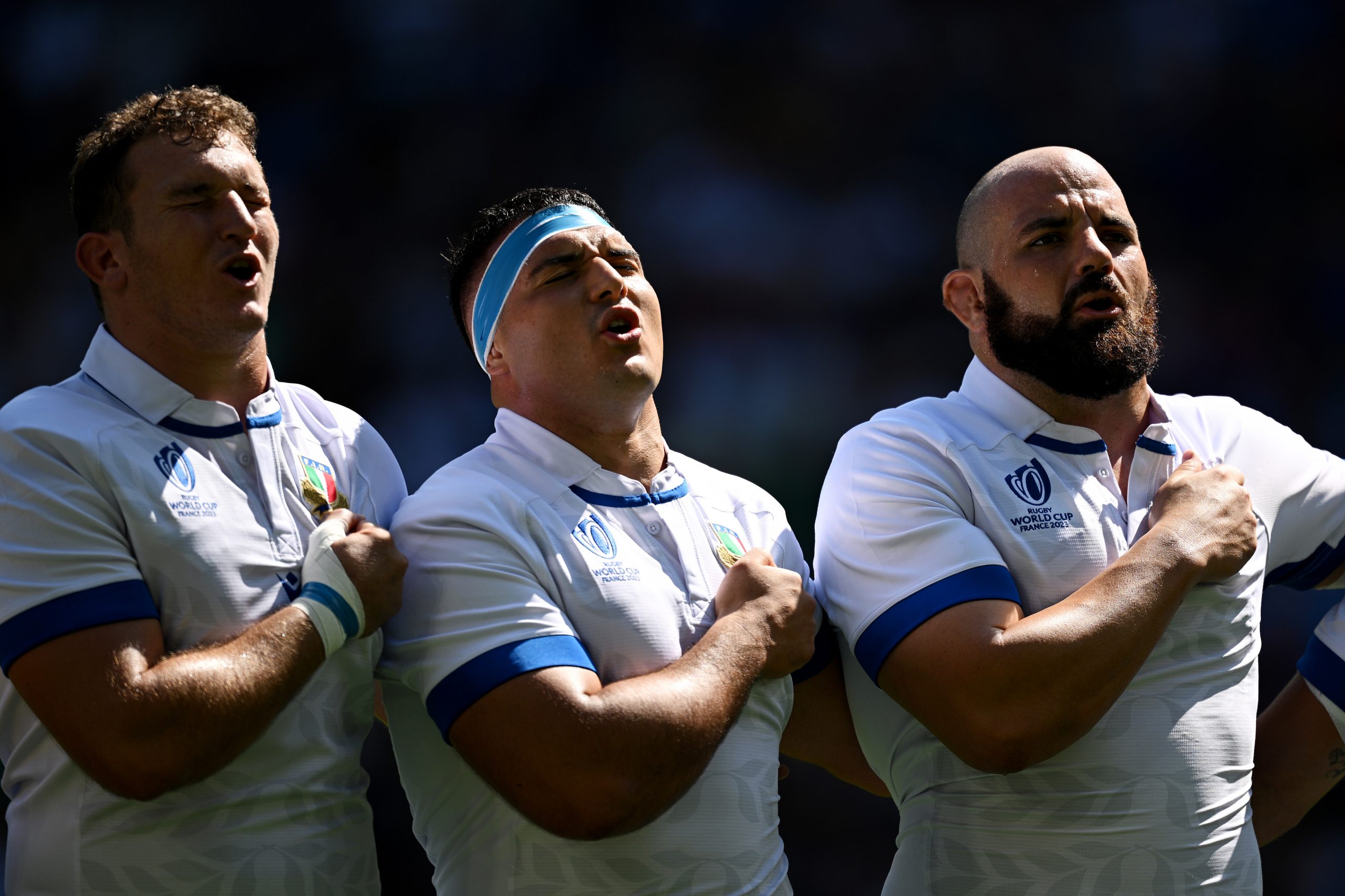 (From left) Michele Lamaro, Sebastian Negri and Simone Ferrari of Italy sing a rendition of the Italian national anthem.