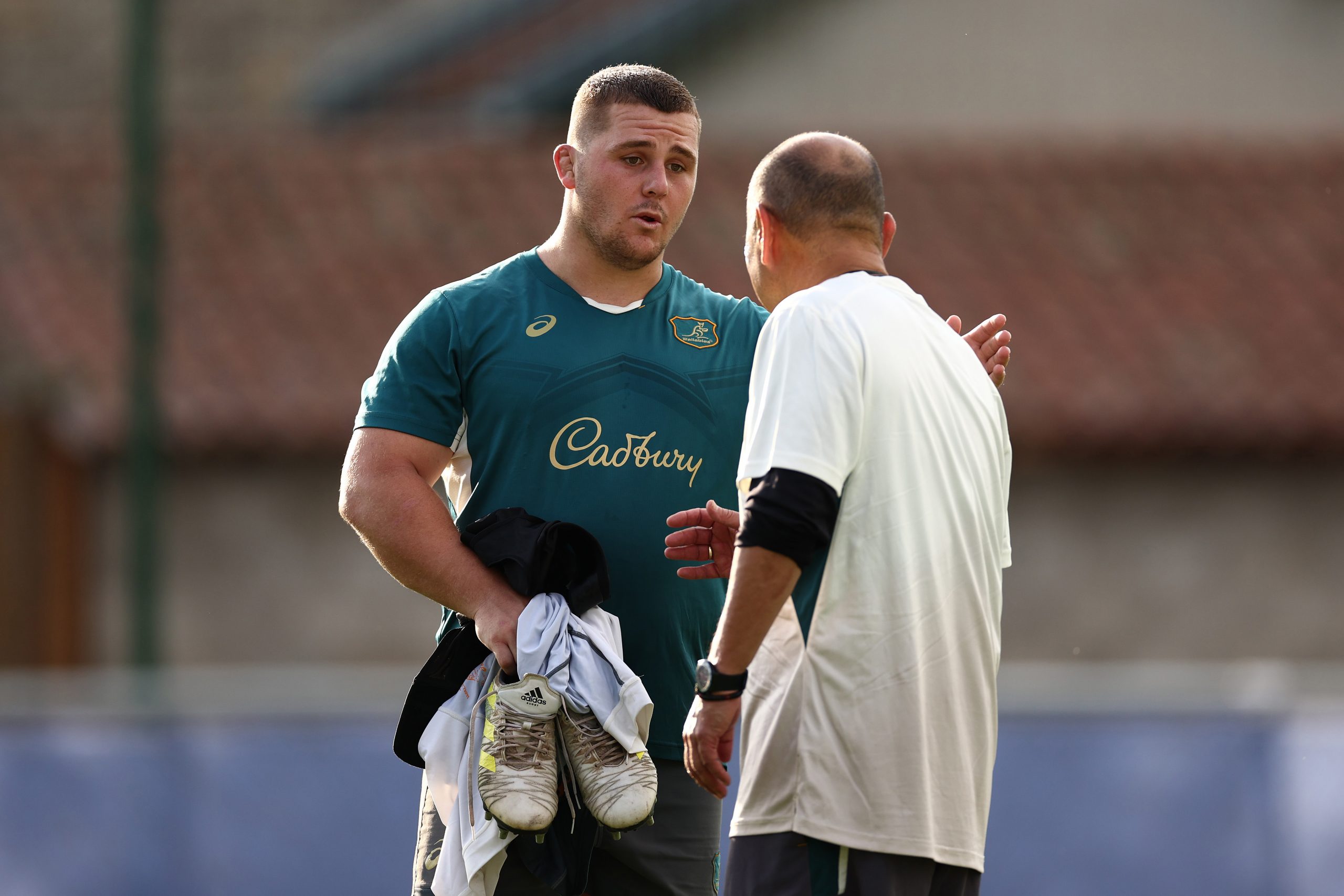 Eddie Jones and Blake Schoupp talk during a Wallabies training session.