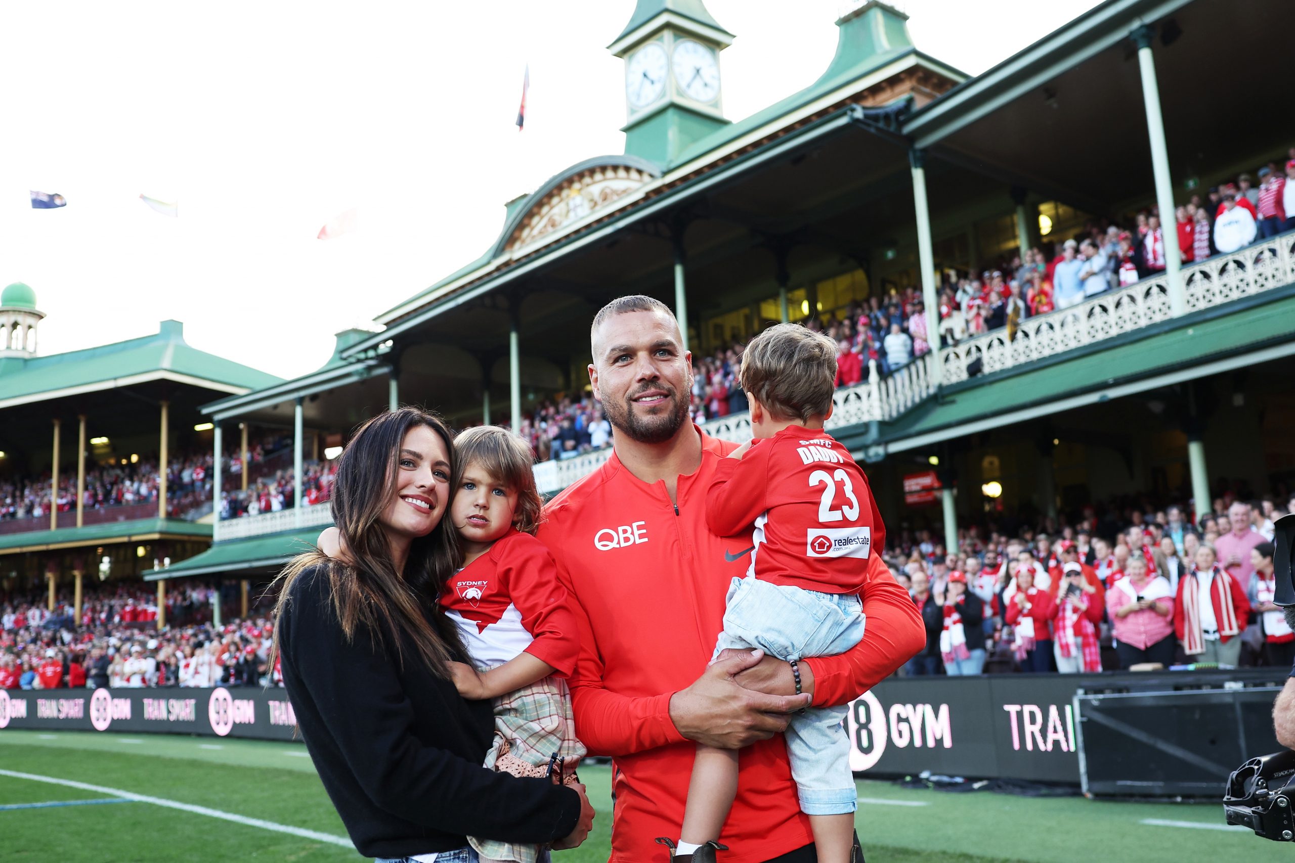 Lance Franklin of the Swans farewells the crowd with his wife Jesinta Franklin and children during a lap of honour during the round 24 AFL match between Sydney Swans and Melbourne Demons at Sydney Cricket Ground, on August 27, 2023