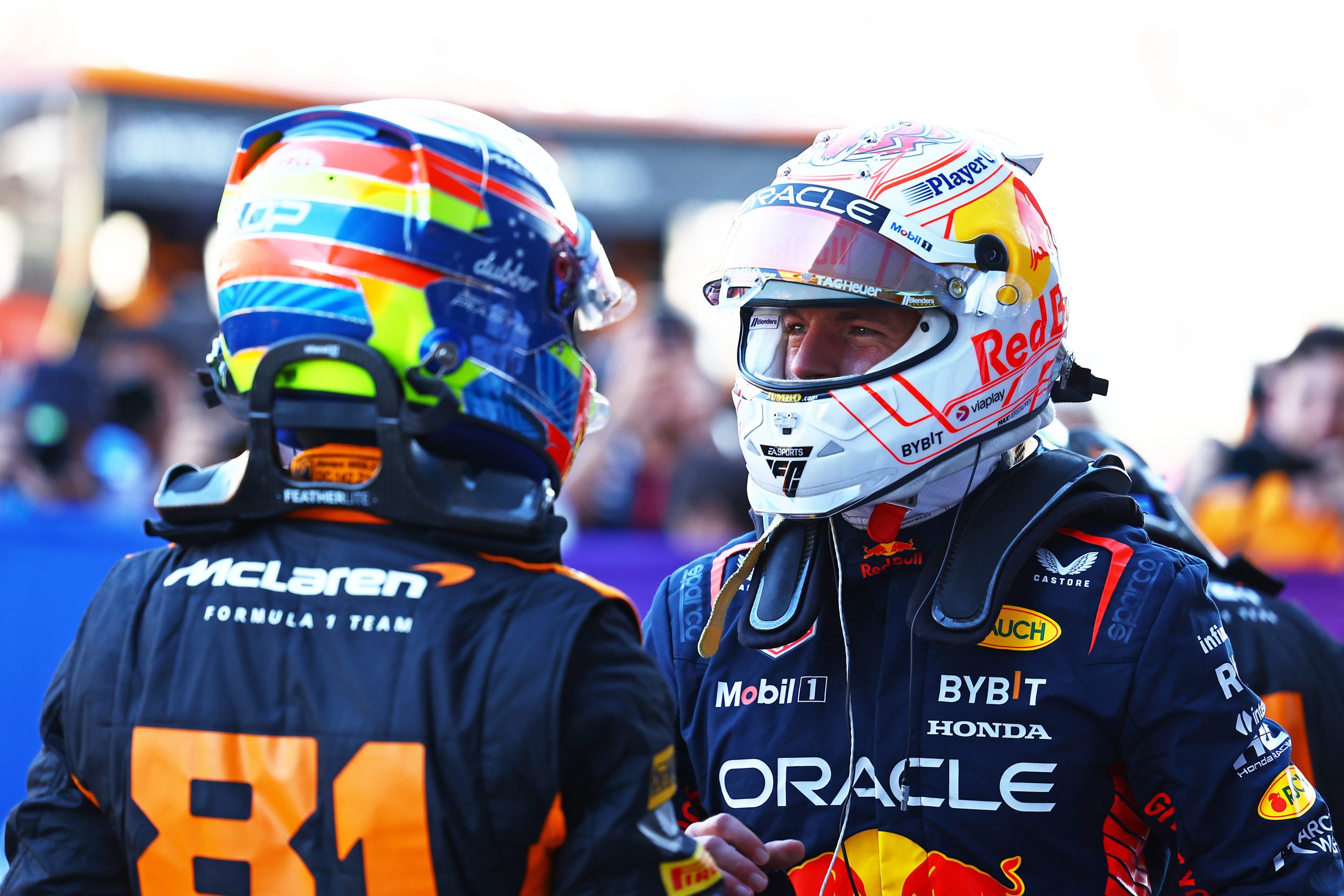 Pole position qualifier Max Verstappen of the Netherlands and Oracle Red Bull Racing talks with second placed qualifier Oscar Piastri of Australia and McLaren in parc ferme during qualifying ahead of the F1 Grand Prix of Japan at Suzuka International Racing Course on September 23, 2023 in Suzuka, Japan. (Photo by Mark Thompson/Getty Images)