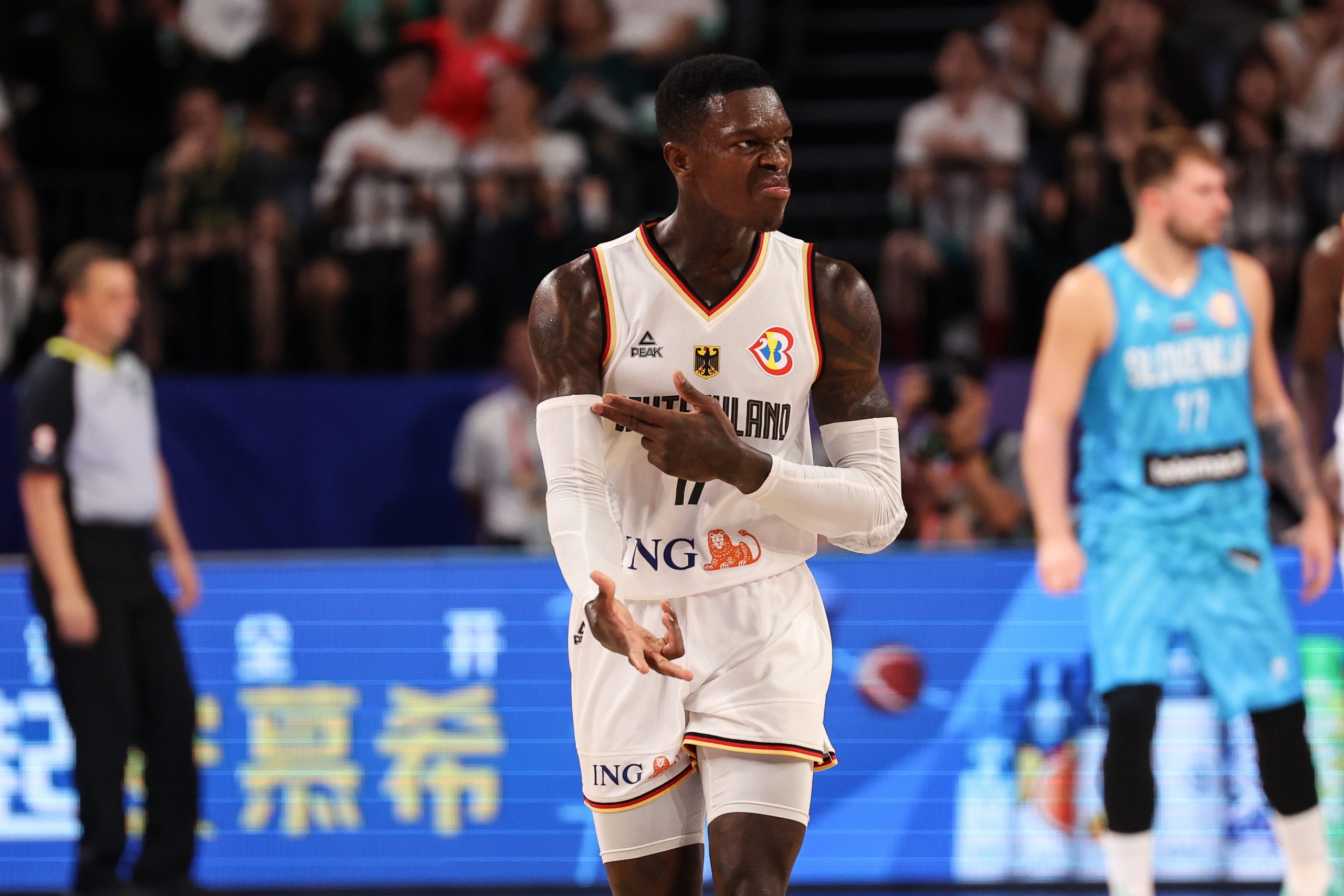 OKINAWA, JAPAN - SEPTEMBER 03: Dennis Schroder #17 of Germany celebrates a three point basket during the FIBA Basketball World Cup 2nd Round Group K game between Germany and Slovenia at Okinawa Arena on September 03, 2023 in Okinawa, Japan. (Photo by Takashi Aoyama/Getty Images)