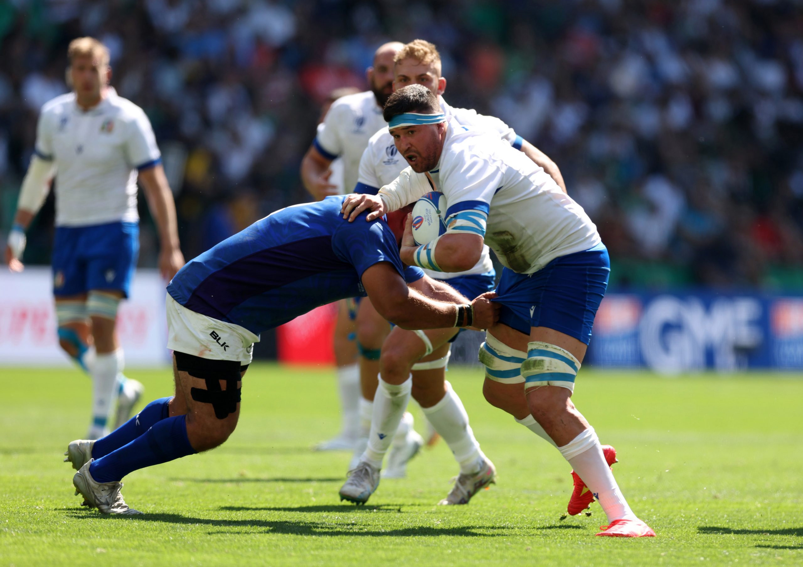 Sebastian Negri is tackled by a French player in their Rugby World Cup clash.