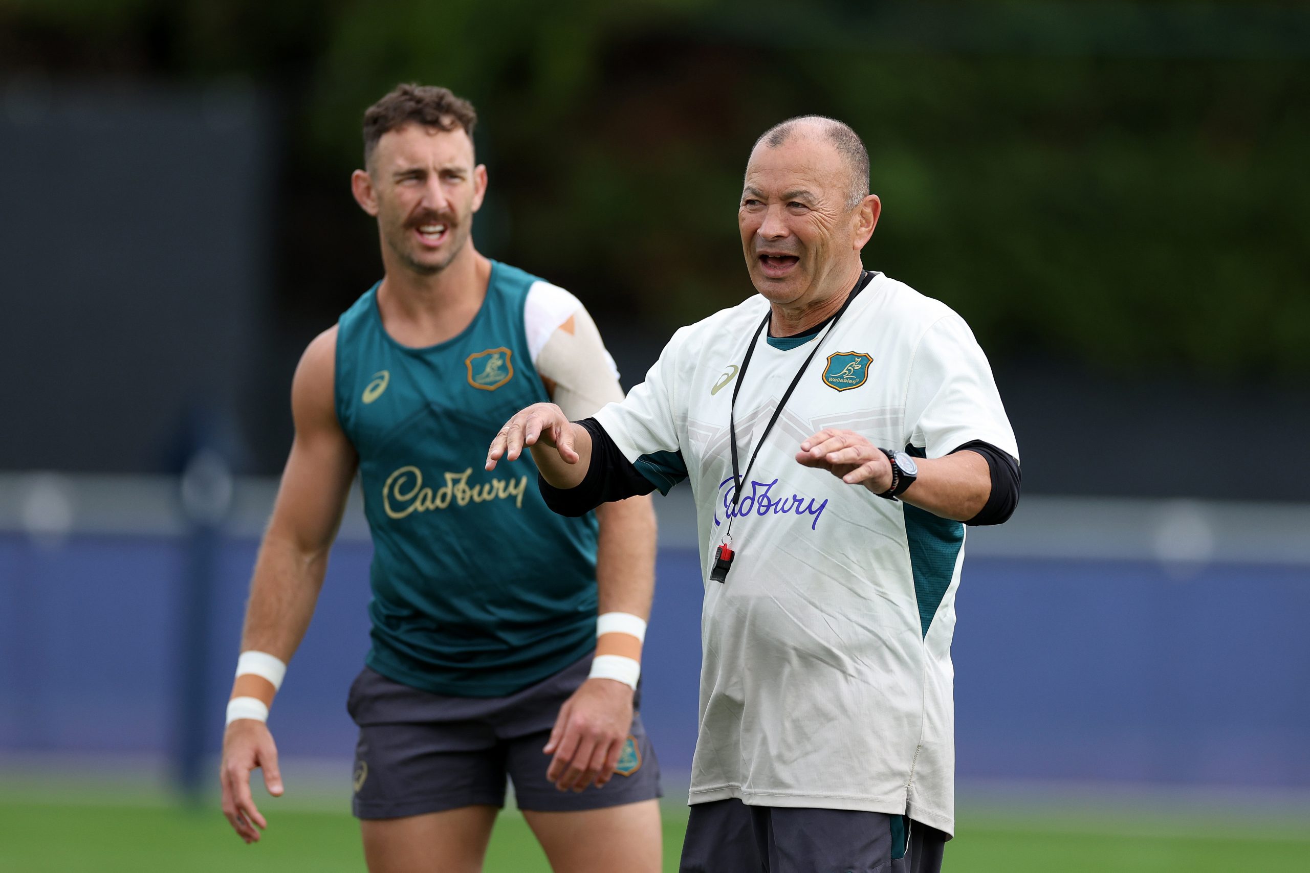 Wallabies coach Eddie Jones (right) with Nic White during a training session.