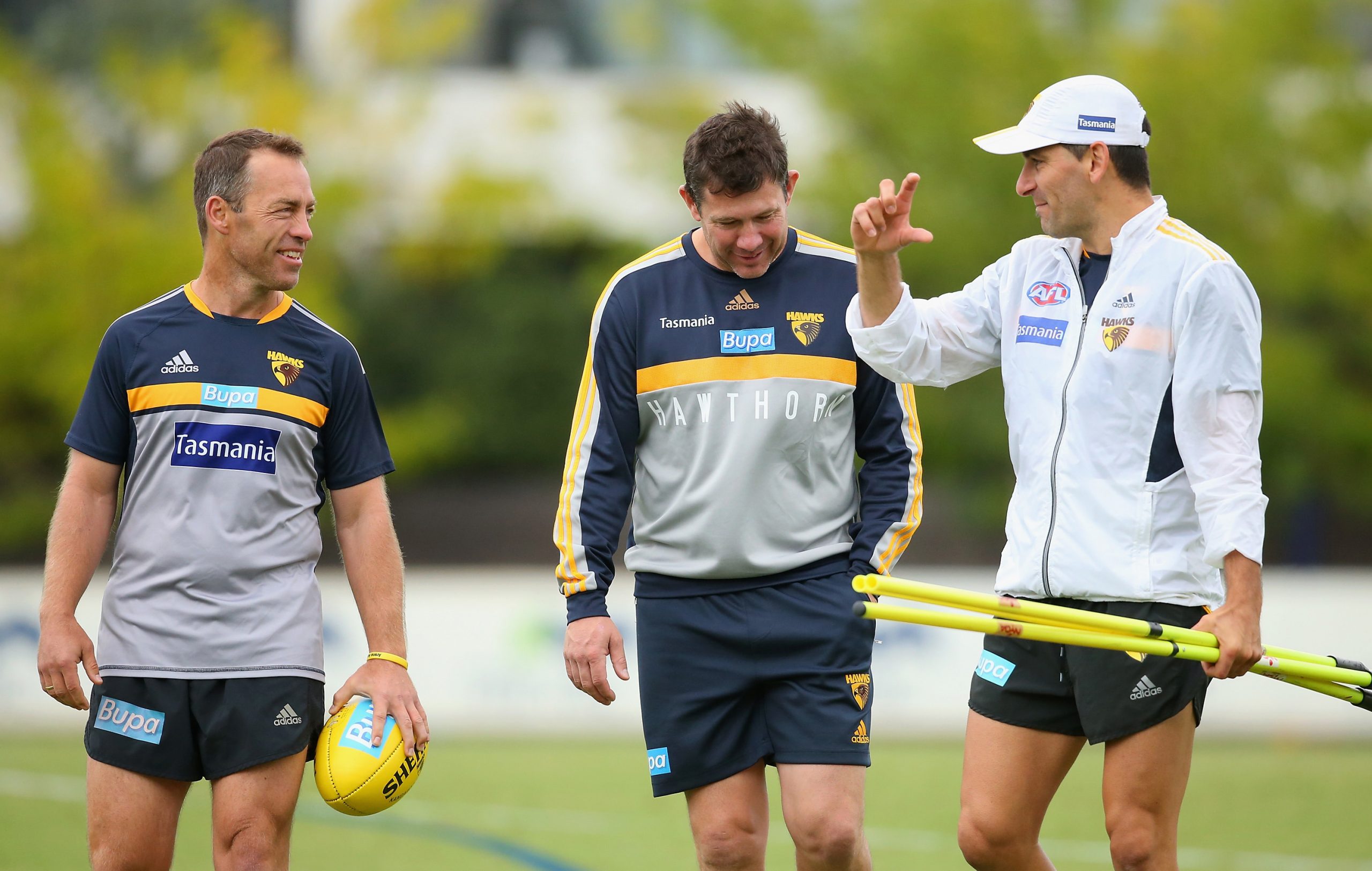 Adem Yze (R) is set to put a call in to Brett Ratten (C), who he coached alongside at Hawthorn under Alastair Clarkson (L)