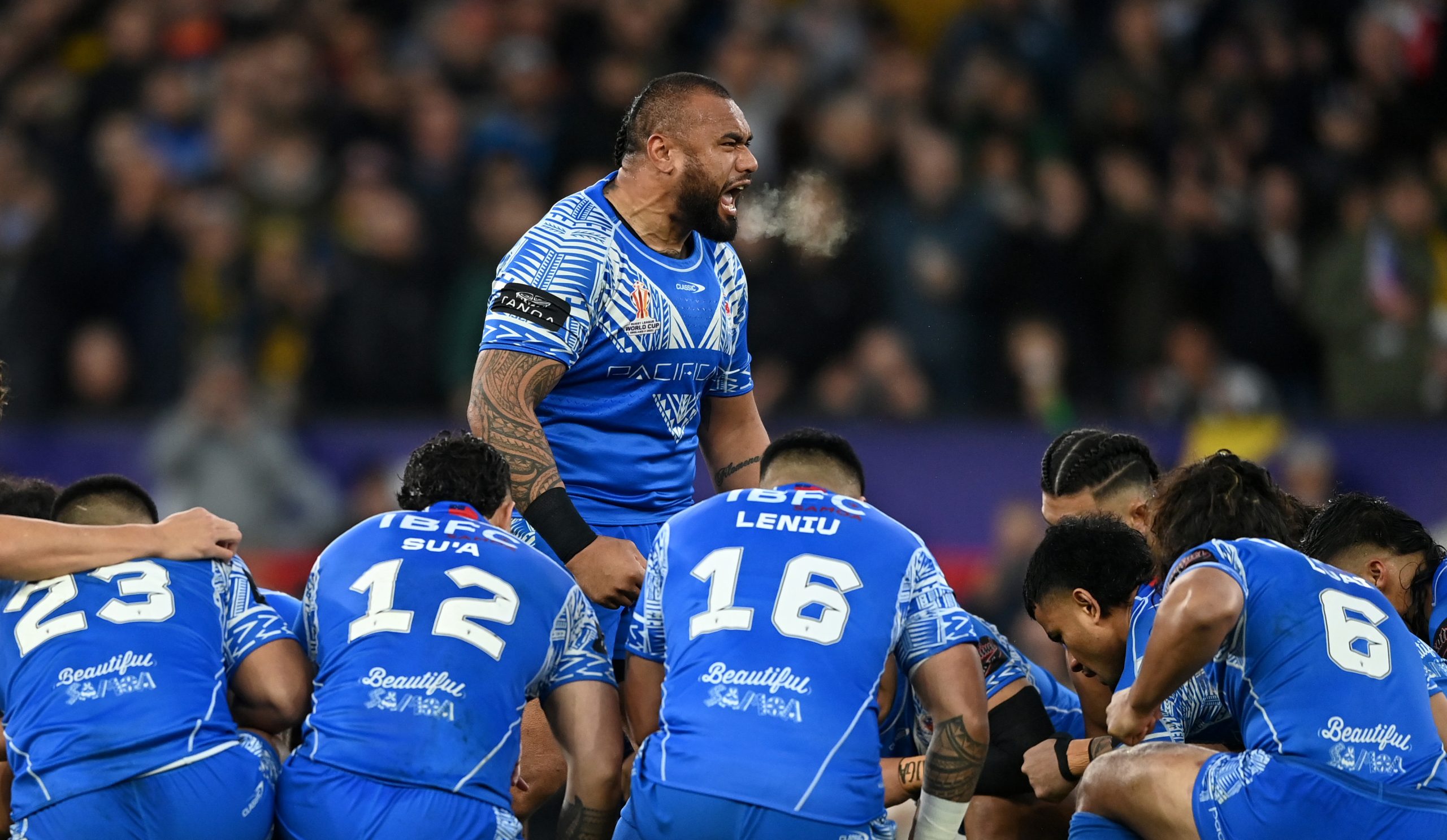 Junior Paulo leads Samoa's Siva Tau ahead of the 2023 Rugby League World Cup final against Australia.